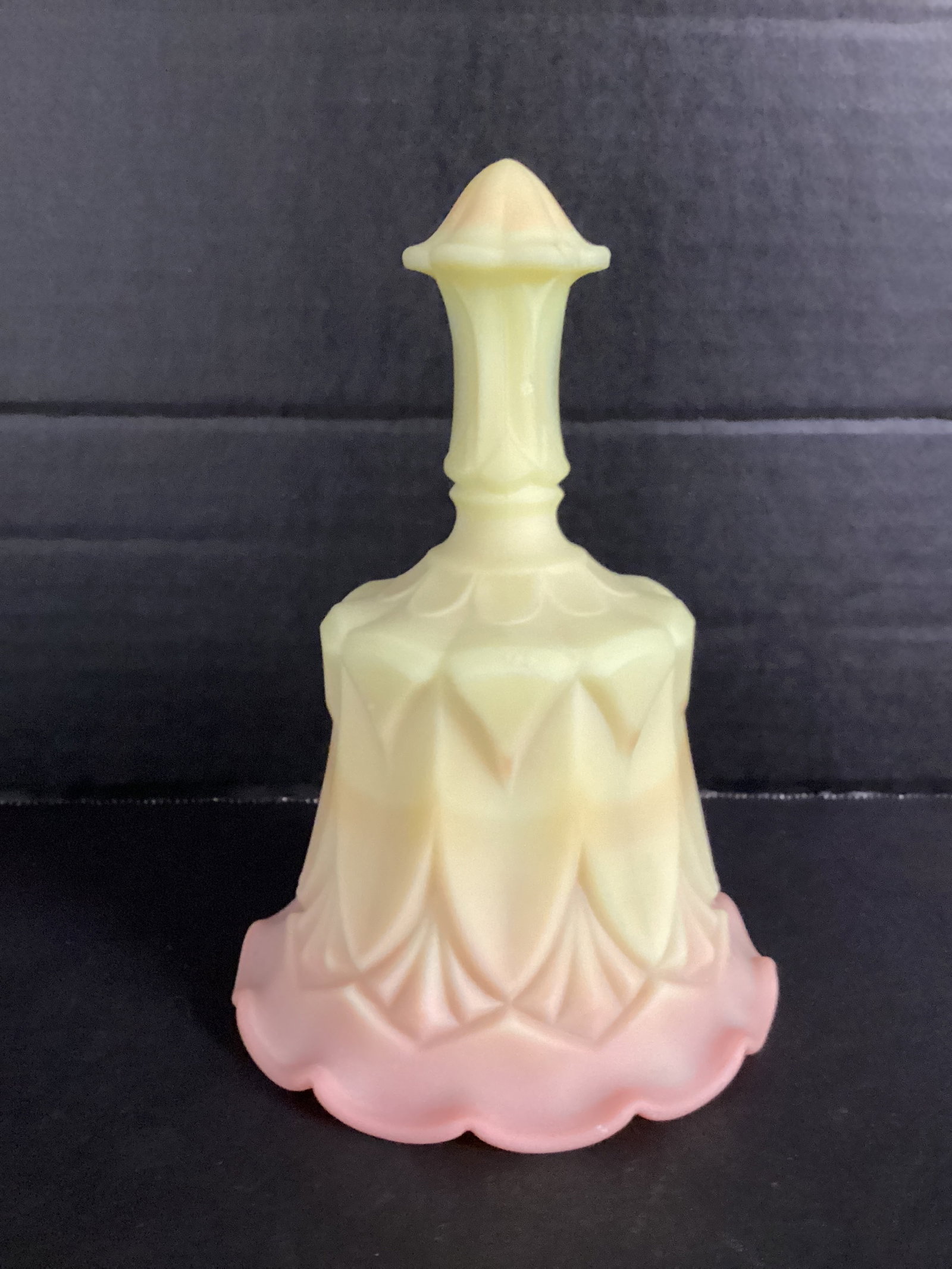 Fenton Burmese Glass Bell: 6 1/2" h, handle chipped
