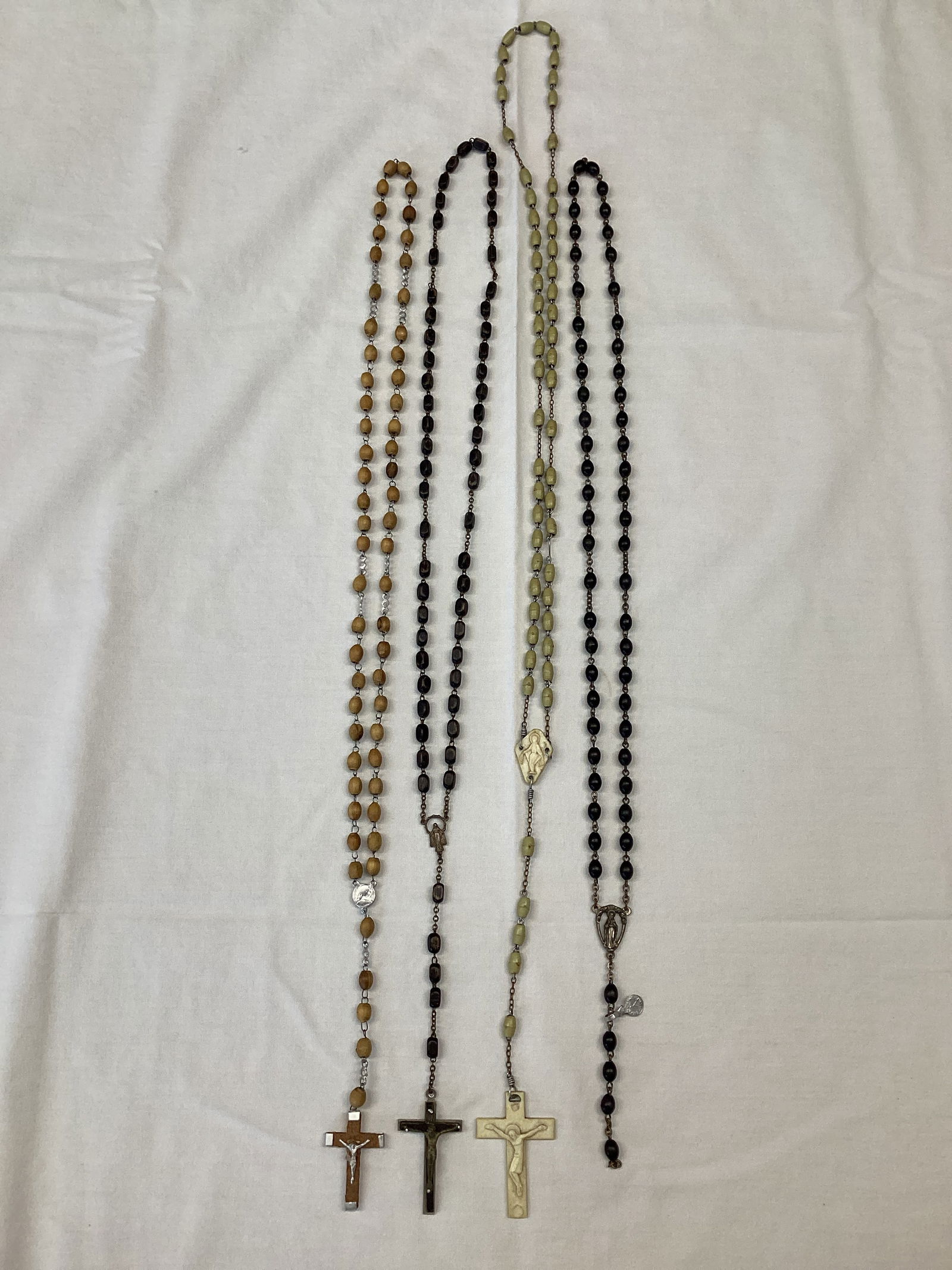 Four Rosaries: one missing cross, 20" - 24"