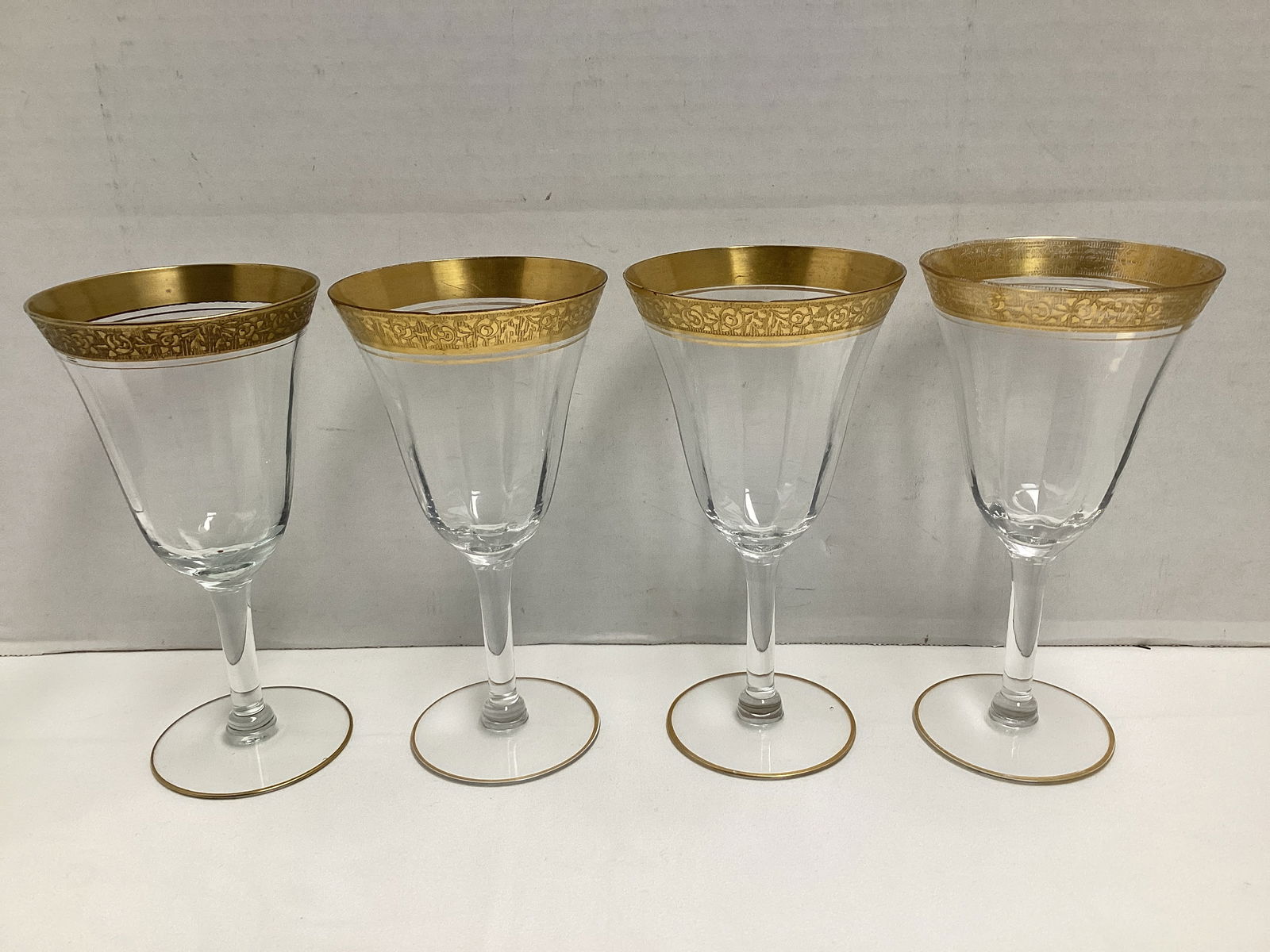 Four Tiffin Rambler Rose Water Goblets: 6 3/4" h, two chipped on rim, wear to gold