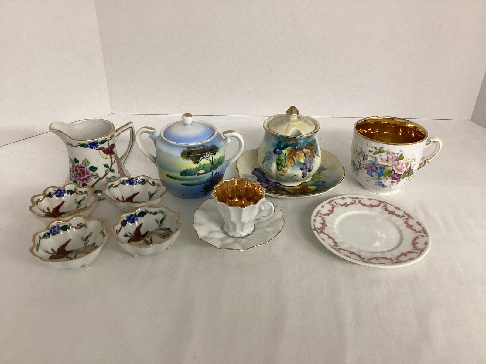 Creamer, Sugar Bowls, Teacups, Saucers, and Condiment Bowls: creamer chipped