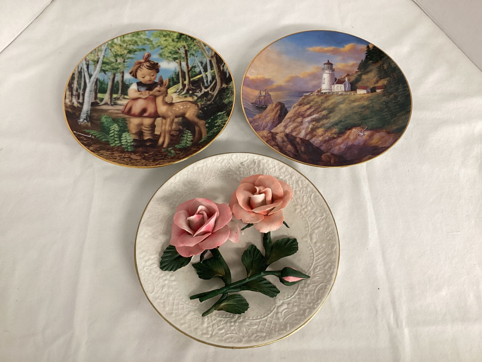 Three Collector's Plates: Danbury Mint Hummel Gentle Friends, Lighthouses Heceta Head Light, and Franklin Mint The Roses of Capodimonte