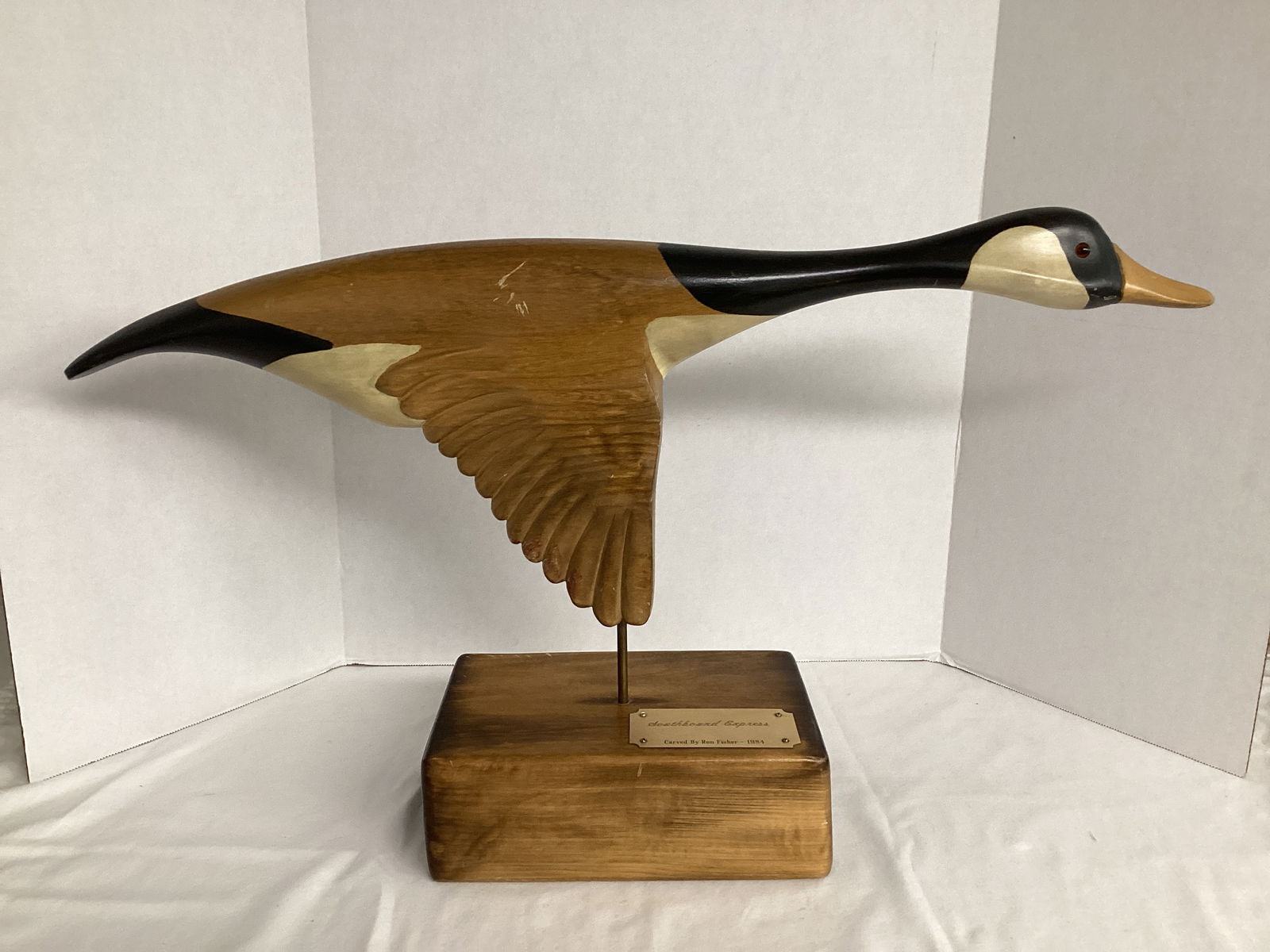 Southbound Express Carved Wood Canada Goose on Stand: Ron Fisher, 1984, 26" long x 15" h