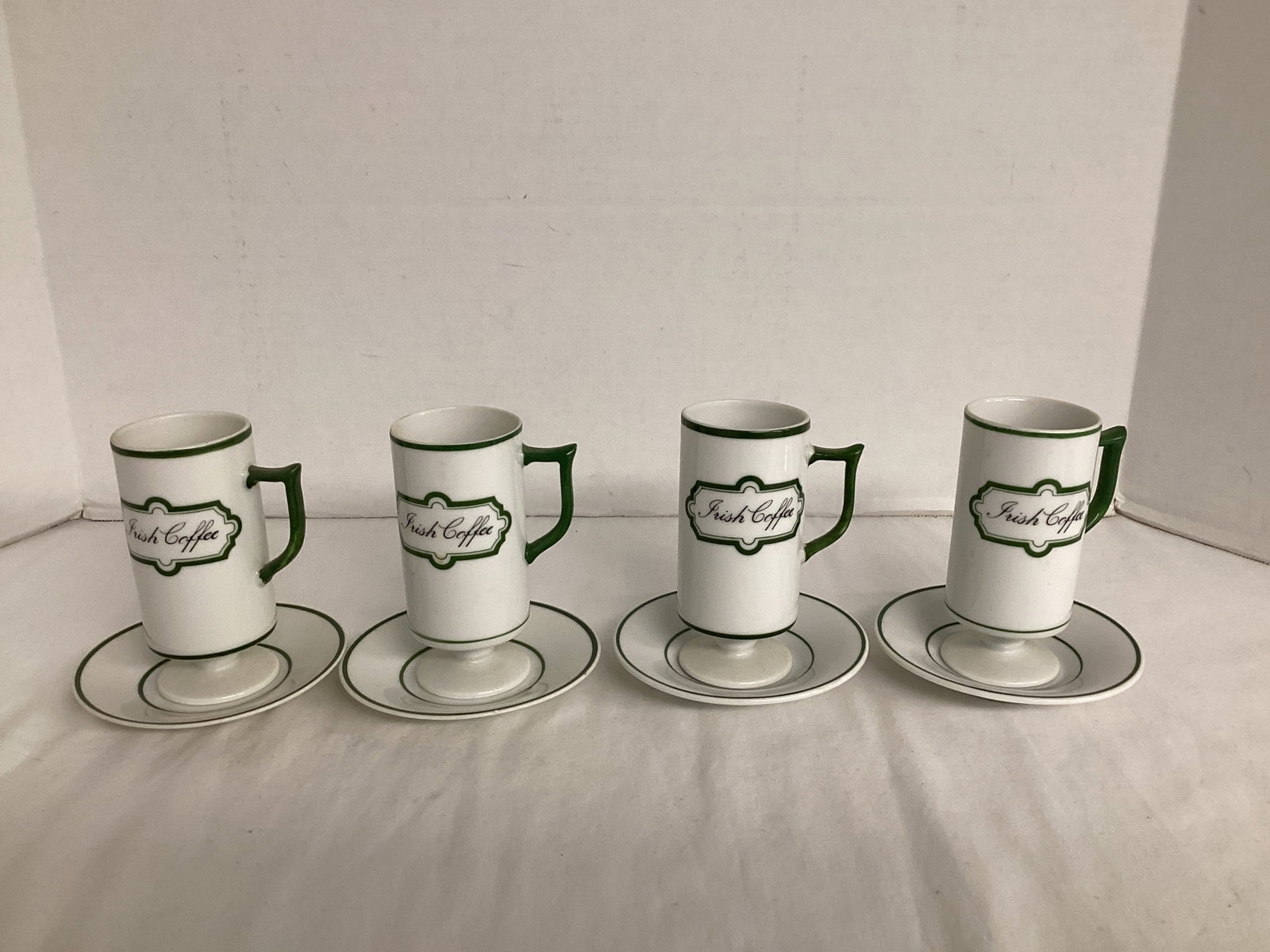 Four Irish Coffee Mugs with Saucers: unmarked mugs 4 1/2" h, two saucers have Viking stickers, two have Knobler Japan stickers