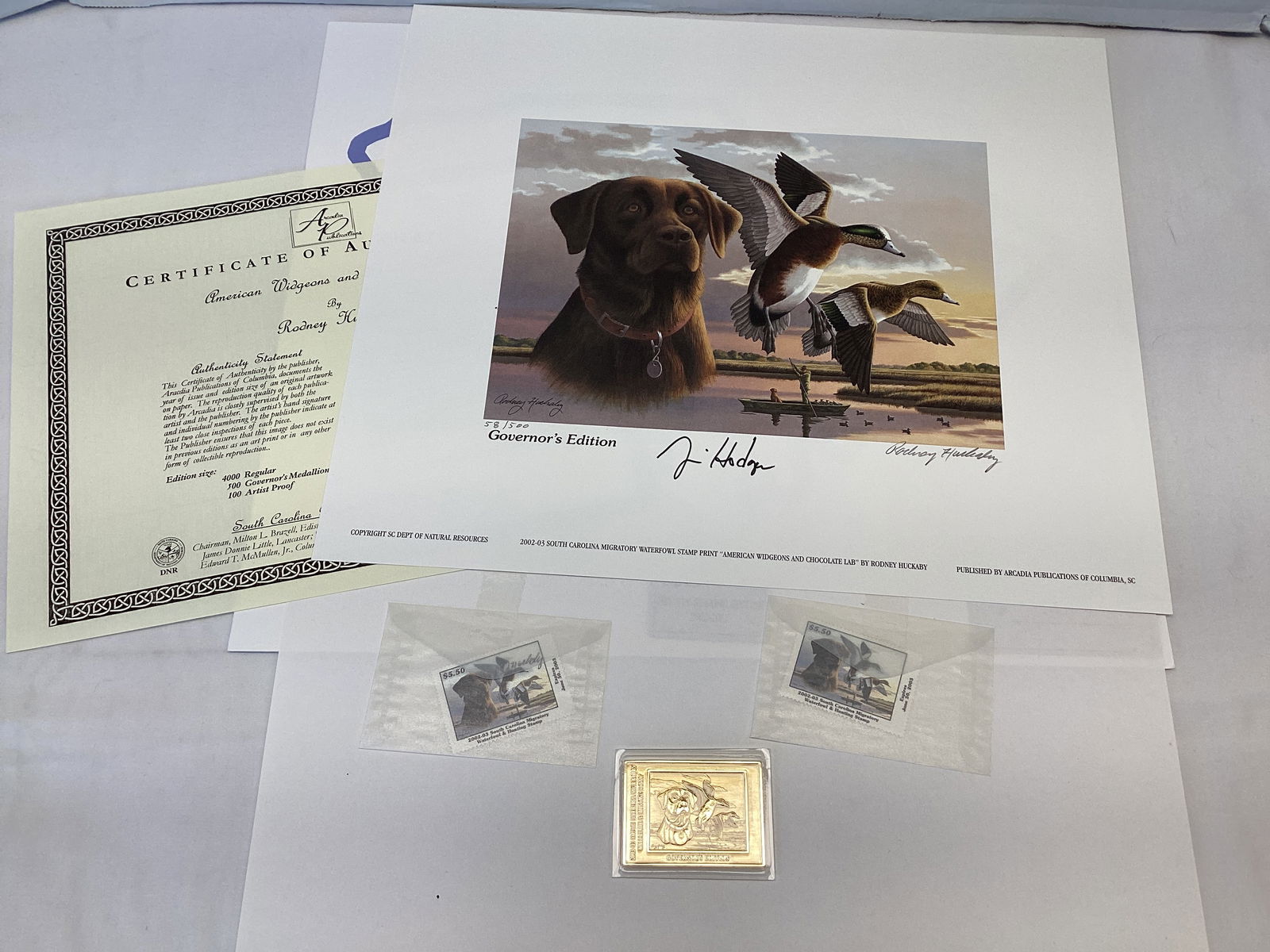 2002 South Carolina Governors Edition Duck Stamp and Print: 14" x 12", 58/500, Governors Medallion, American Widgeons and Chocolate Lab, signed by Governor Jim Hodges and artist Rodney Huckaby, one stamp signed