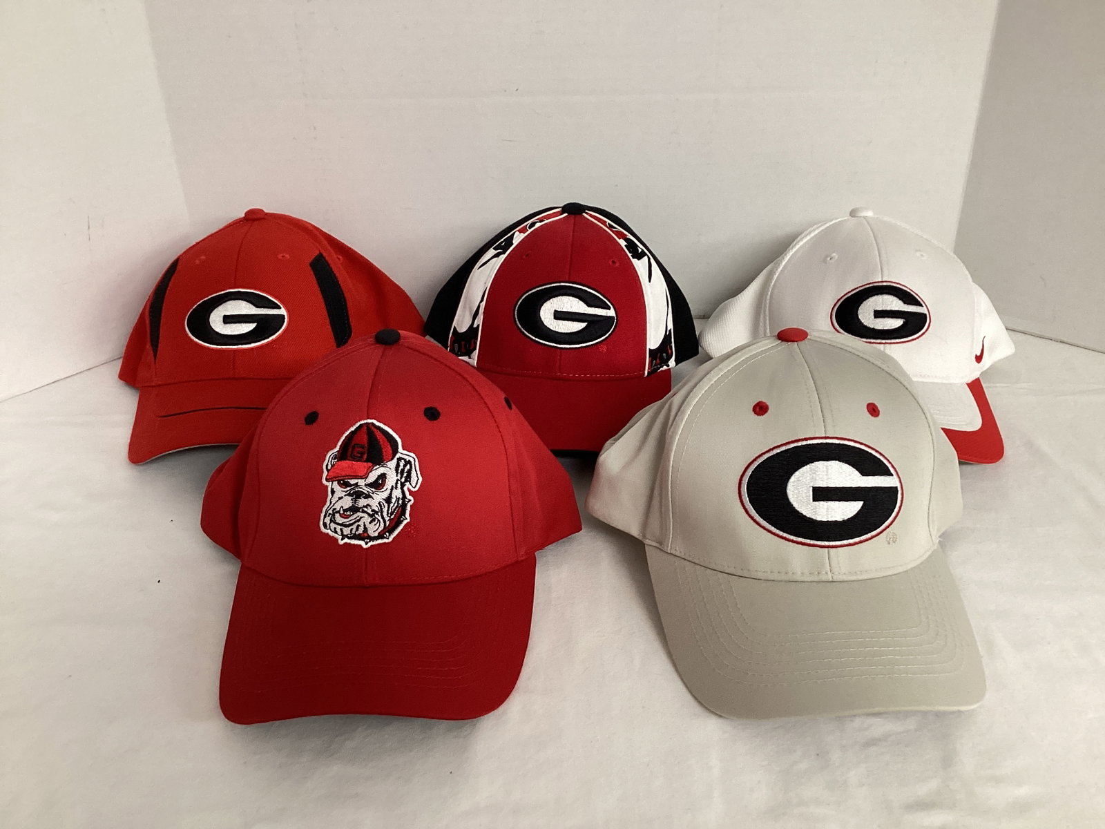 Five Georgia Bulldogs Hats: one is youth size