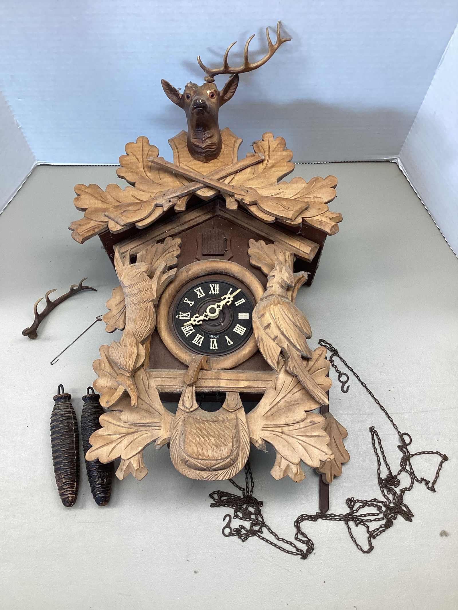 German Huntsman Cuckoo Clock with Wood Carved Bird, Rabbit, and Deer (1 of 11)