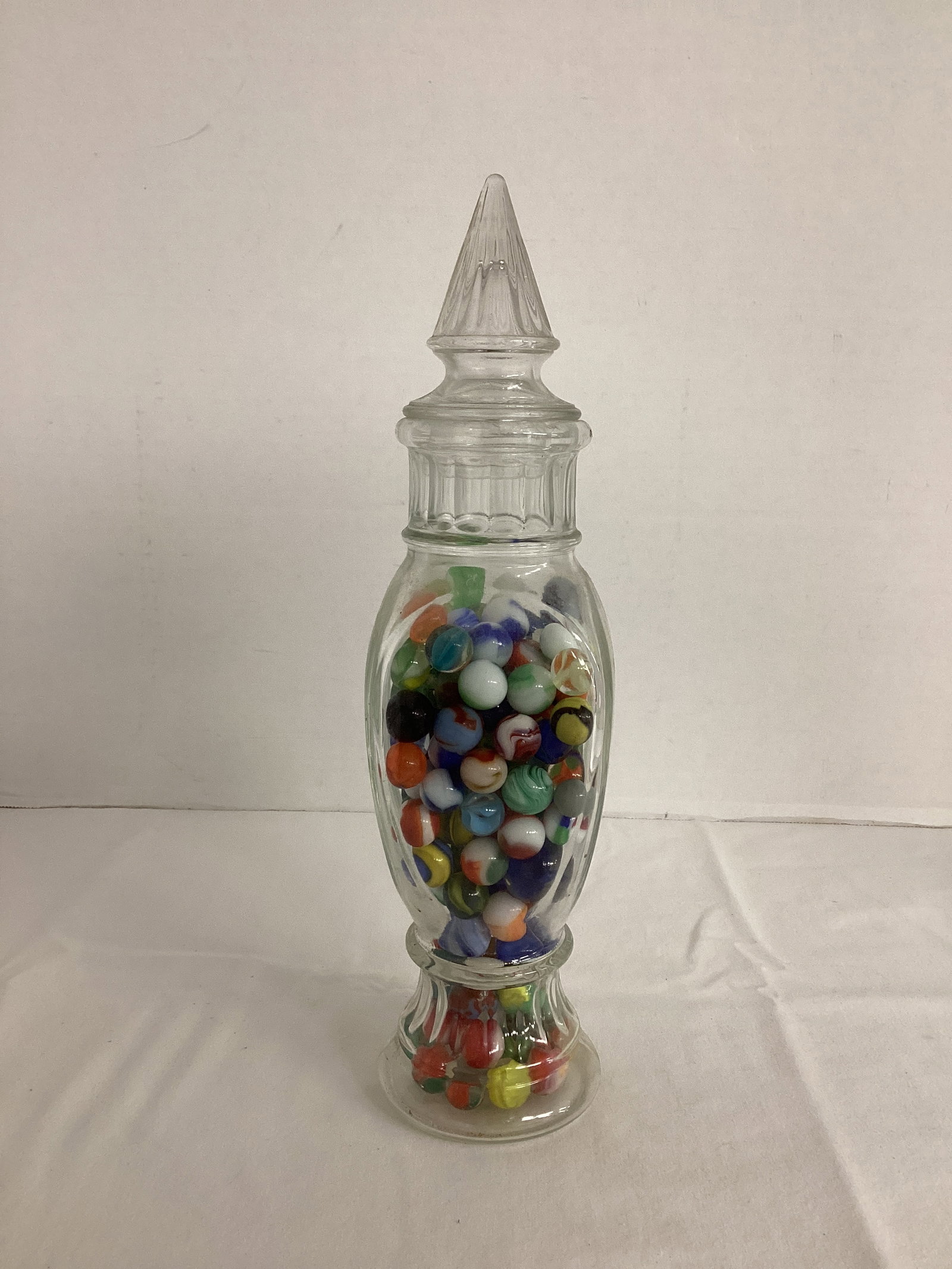 Tall Jar with Marbles: one uranium glass, 13" h
