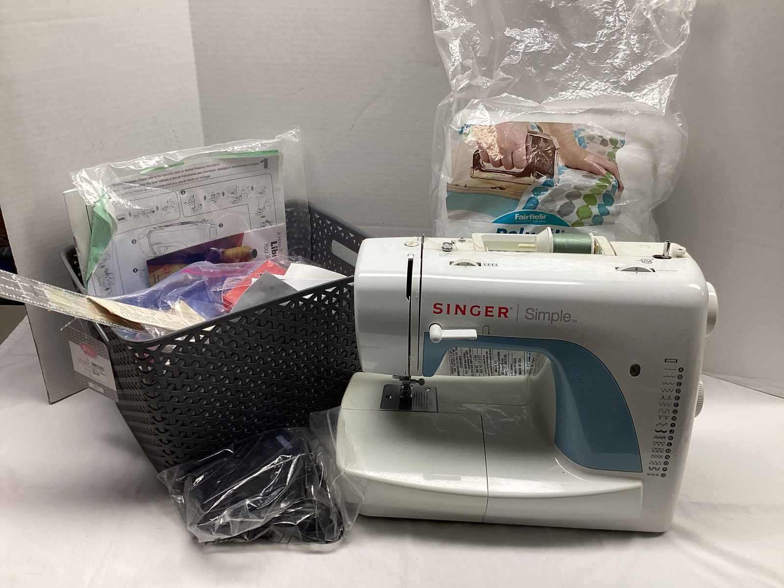 Singer Sewing Machine and Sewing Supplies: sewing machine powers on, light comes on, needle does not move, shipping unavailable for this lot