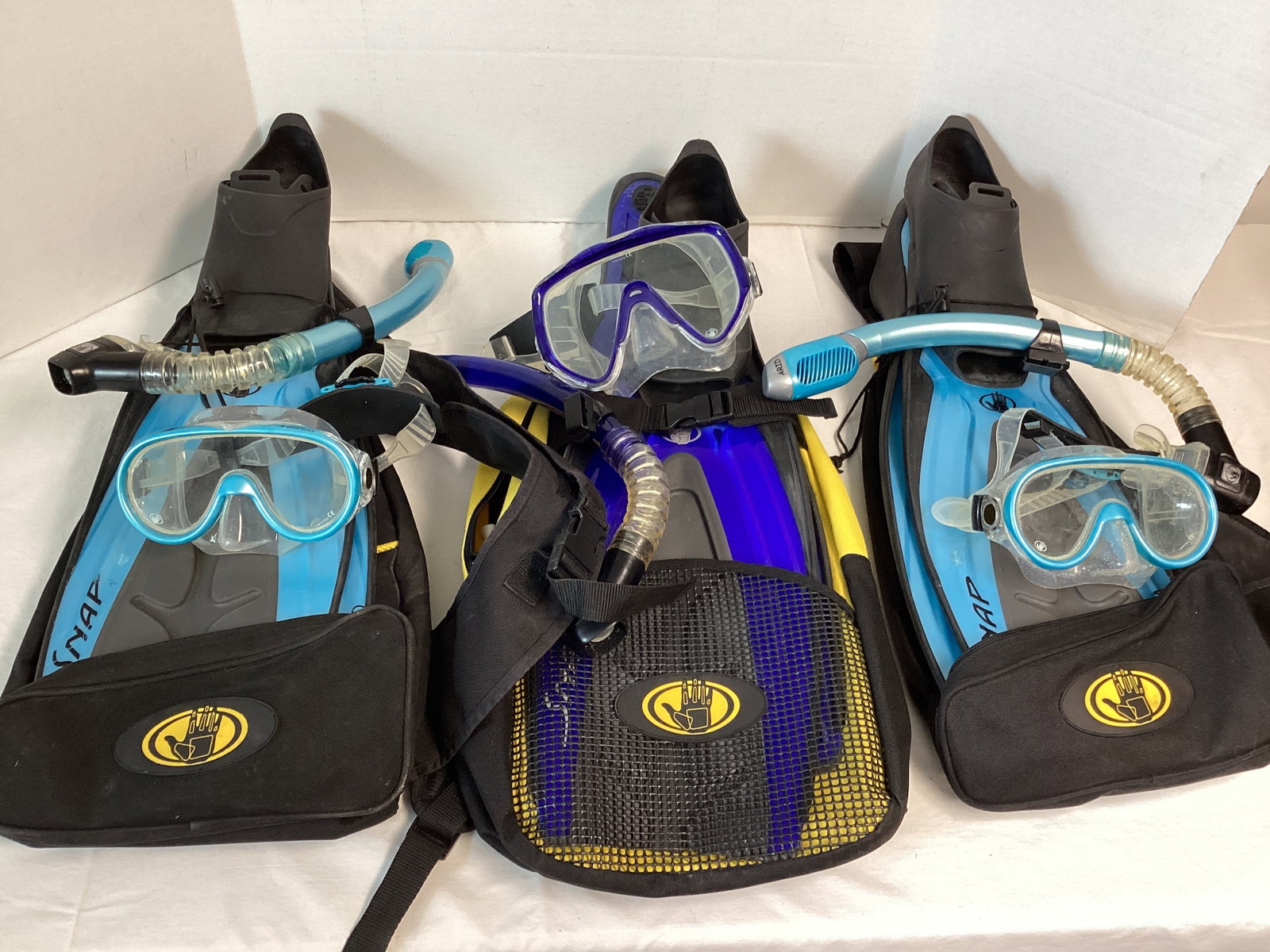 Three Sets of Body Glove Snorkeling/Scuba Gear with Packs: Three masks, snorkels, and fins. Fins size M 6-7 (40-41) and ML 8-9 (42-43)
