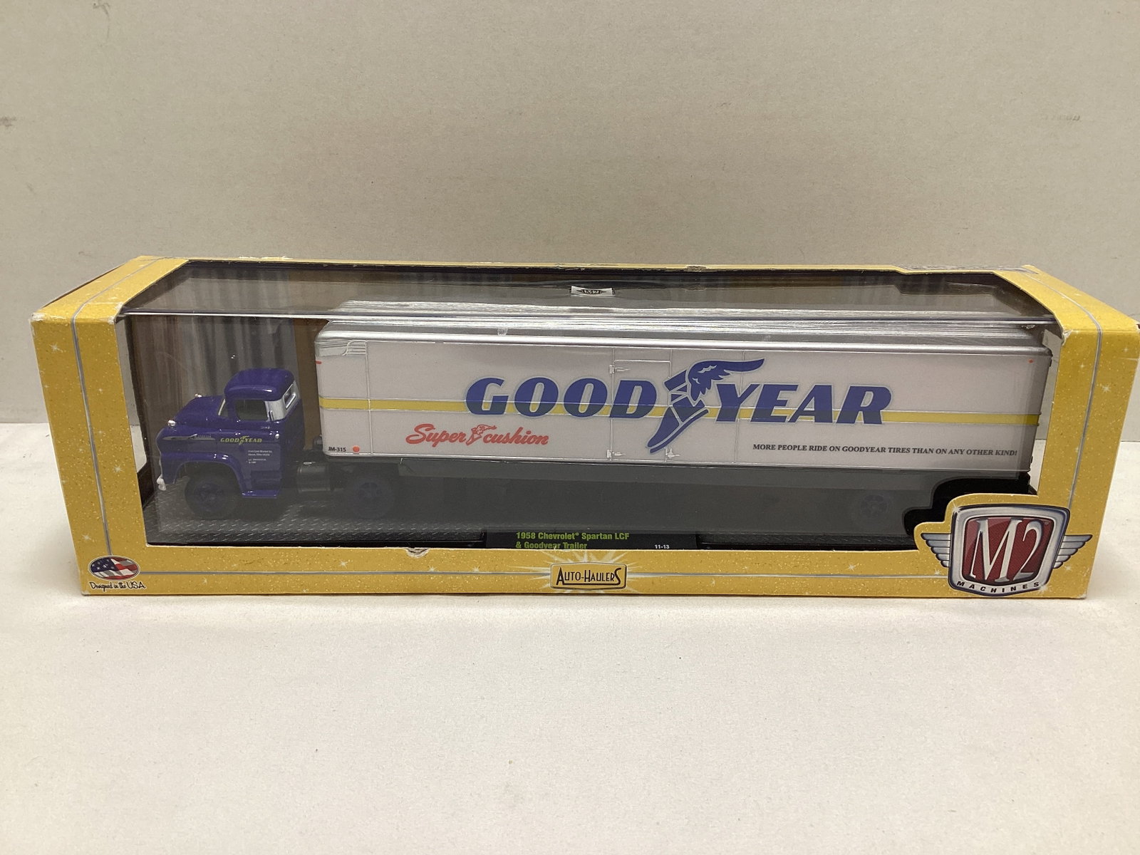 M2 Machines Auto-Haulers 1958 Chevrolet Spartan LCF with Goodyear Trailer Diecast: back of trailer loose in box