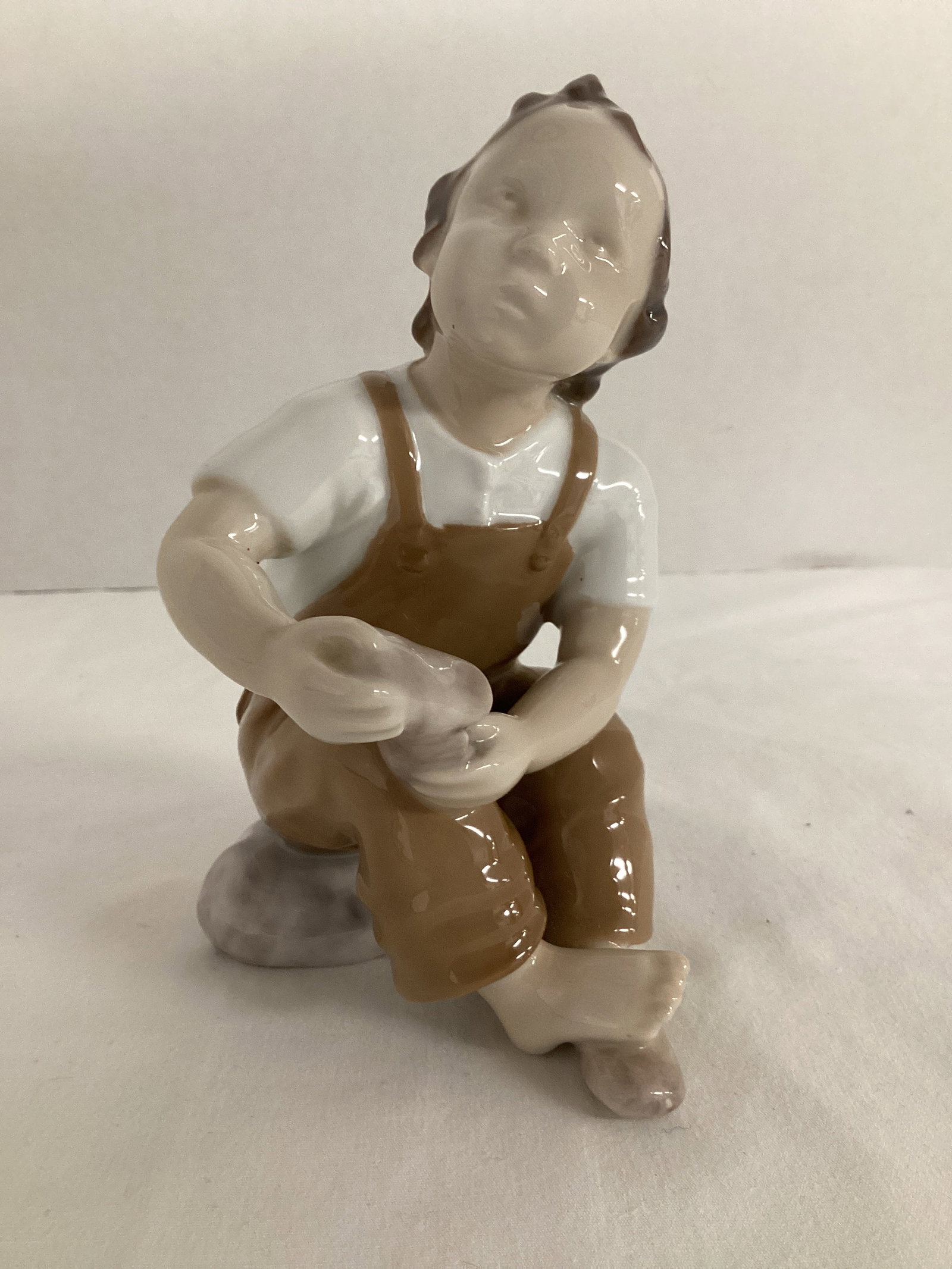 B&G Denmark Boy with Shoes Figurine: 5 1/4" h