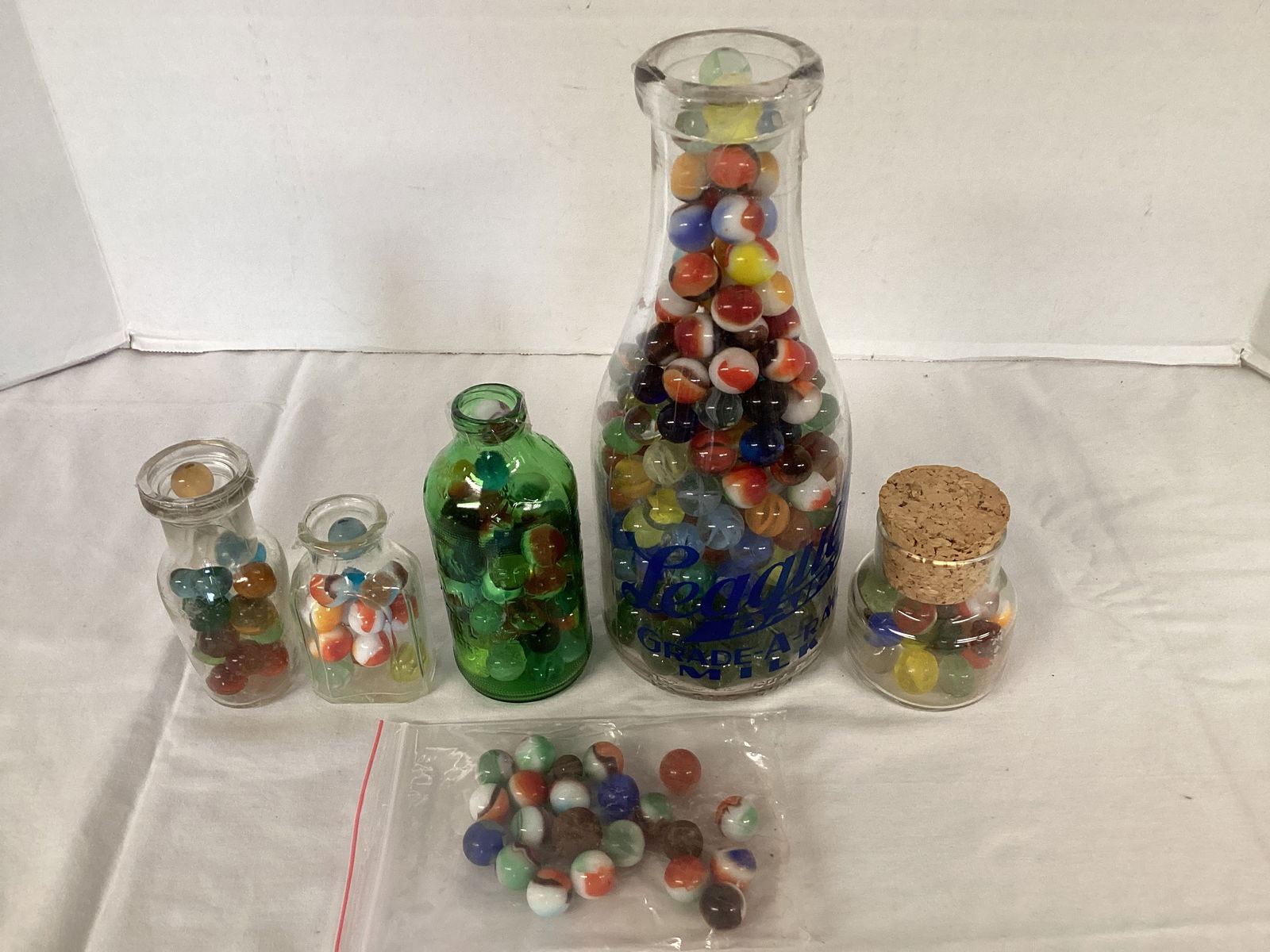 Marbles in Glass Bottles: 4" to 10" h