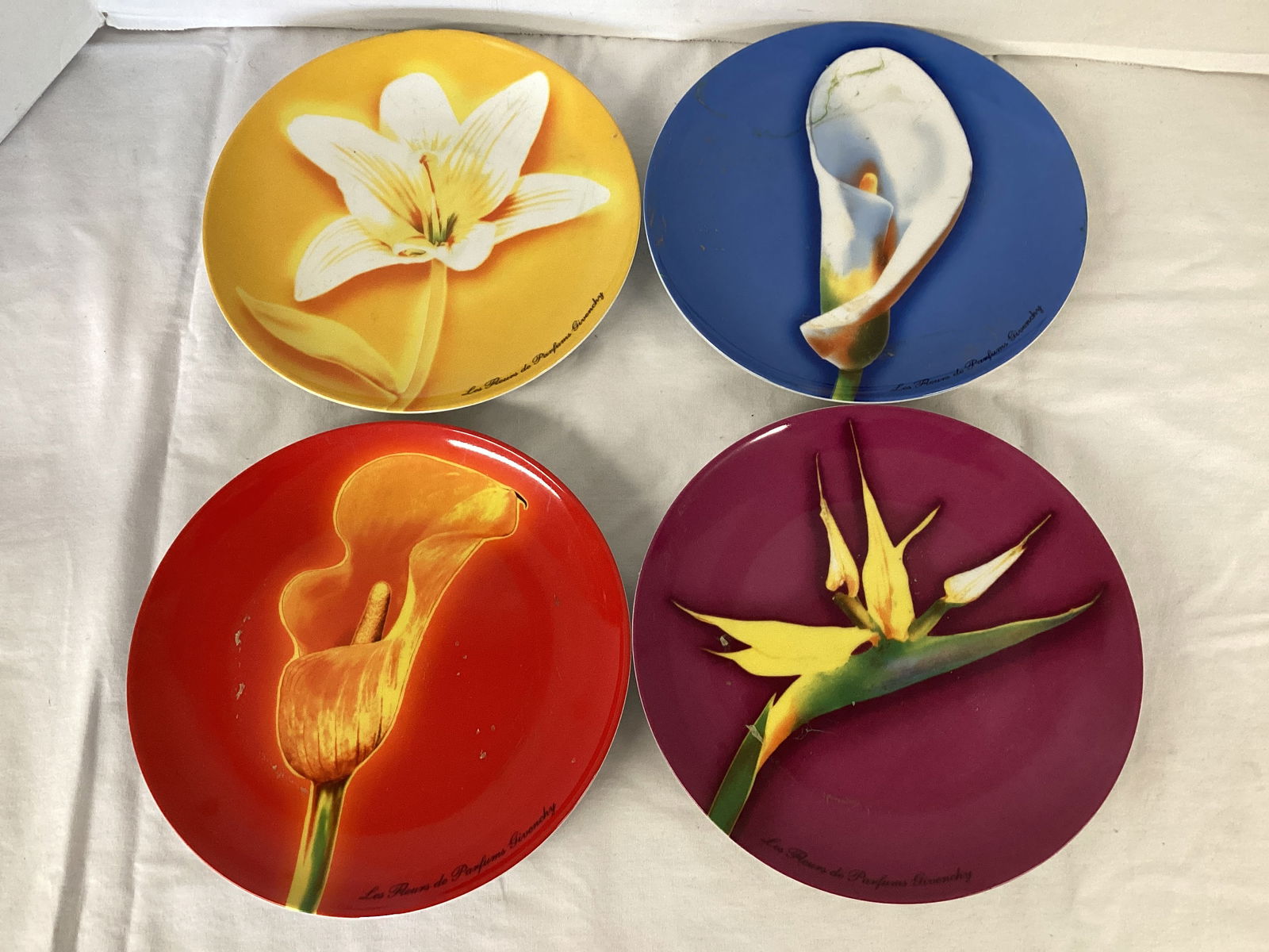 Four Les Fleurs de Parfums Givenchy Flower Plates: 8 1/4" diameter