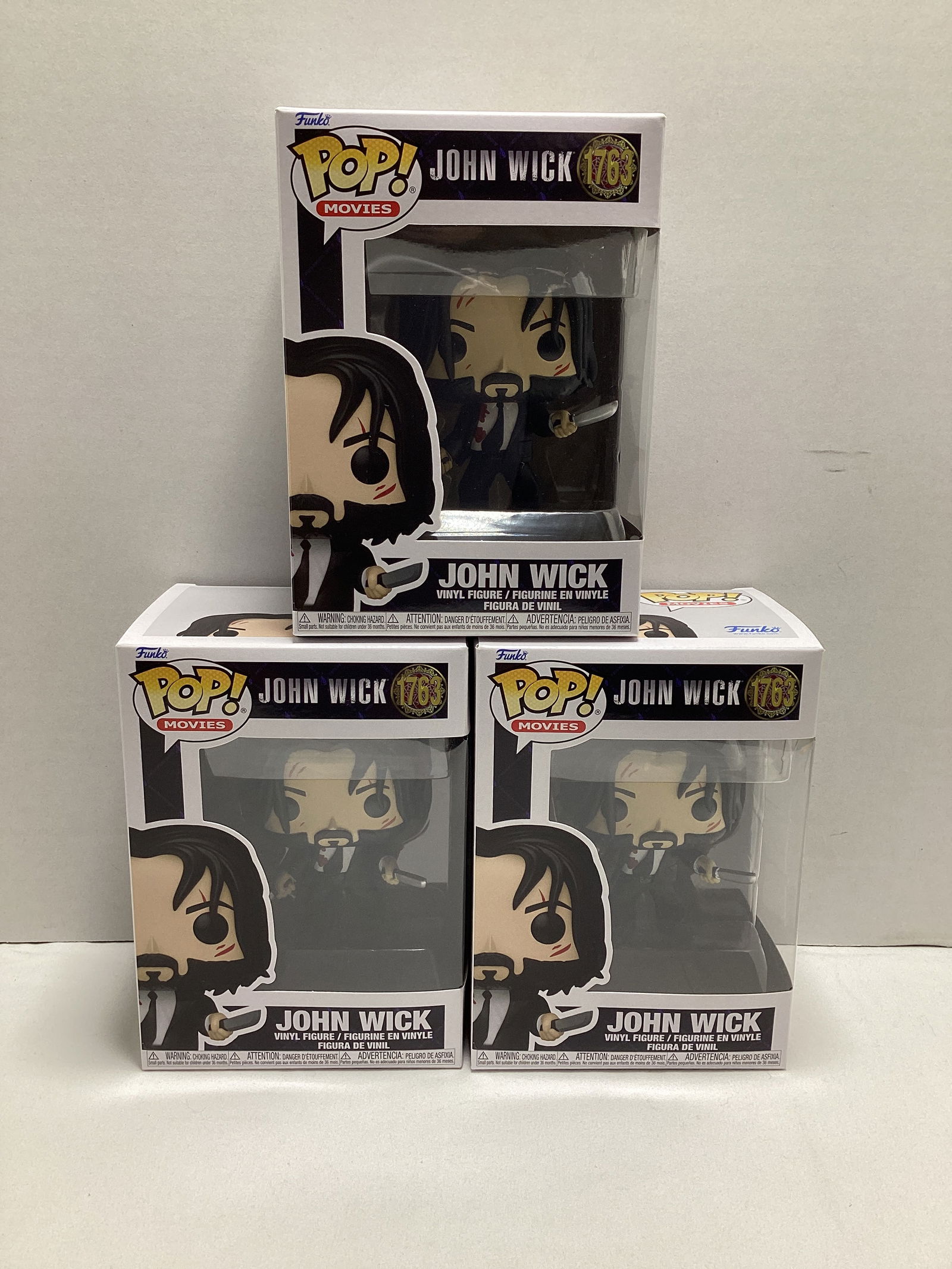Three John Wick Funko Pops: .