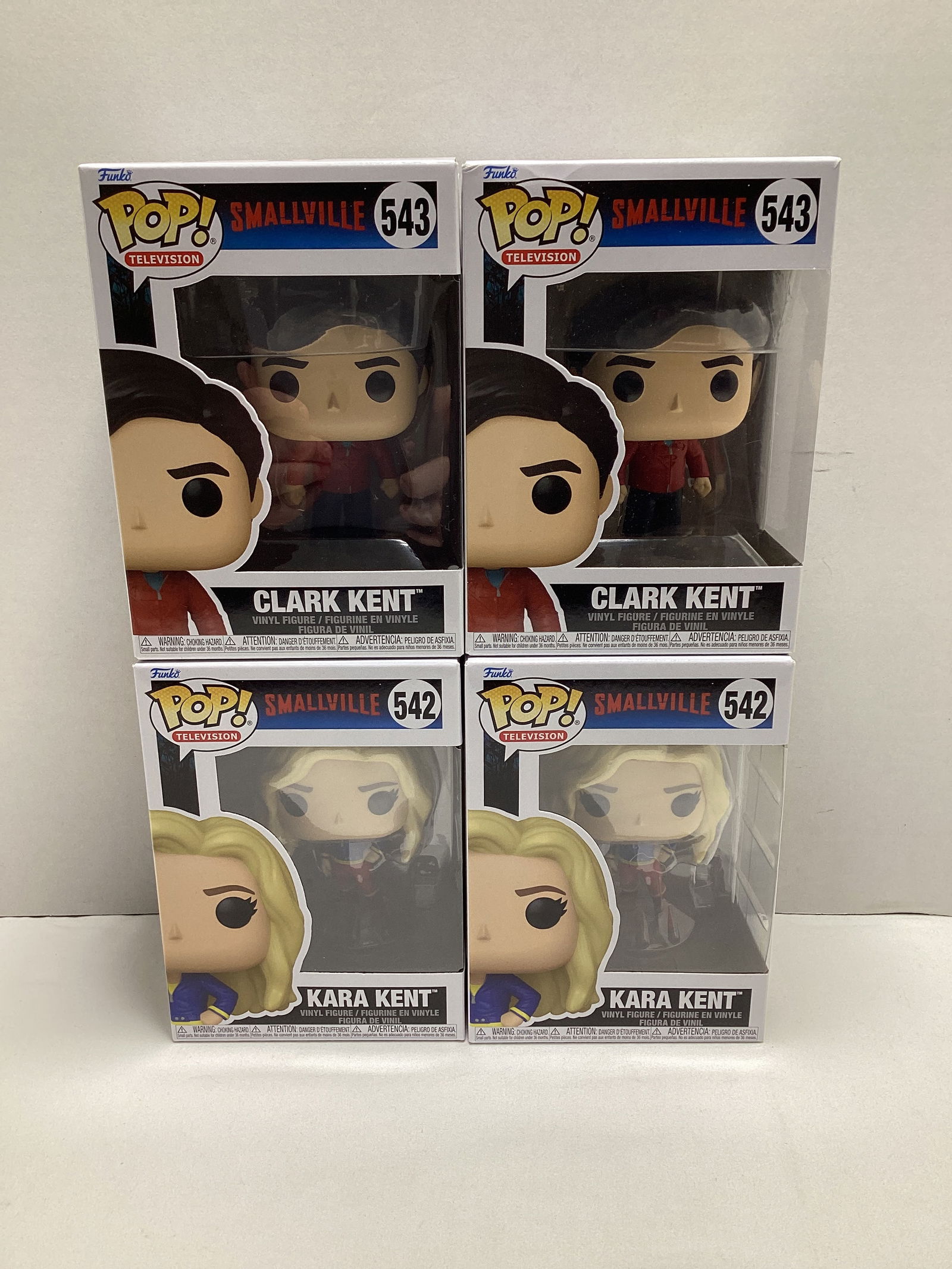 Four DC Comics Smallville Funko Pops: Clark Kent (Superman), x2, Kara Kent (Supergirl) x2
