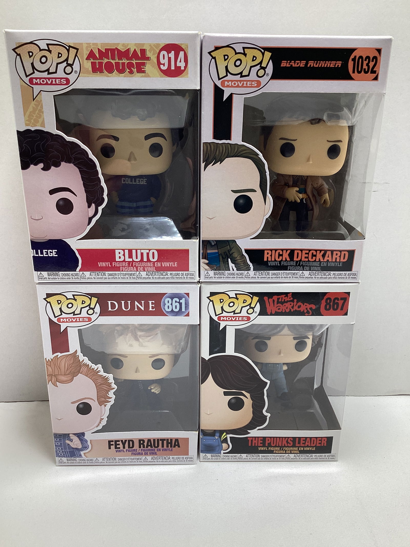 Four Movies Funko Pops: Bluto, Rick Deckard, Feyd Rautha, the Punks Leader