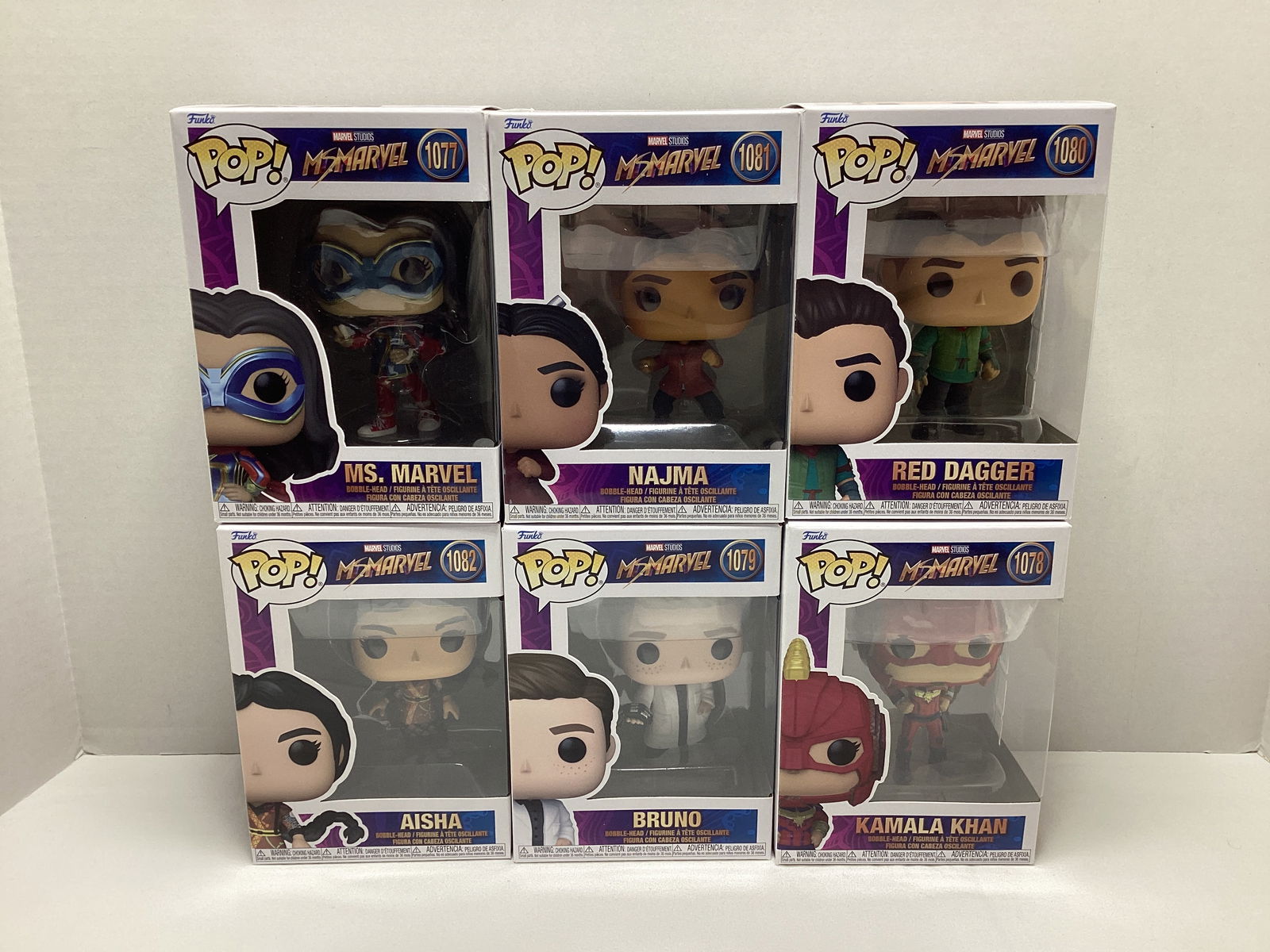 Six Ms. Marvel Funko Pops: . 