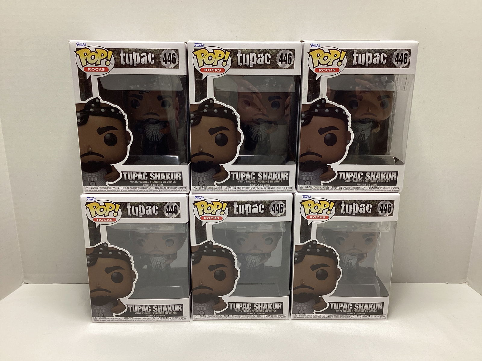 Six Tupac Funko Pops: . 