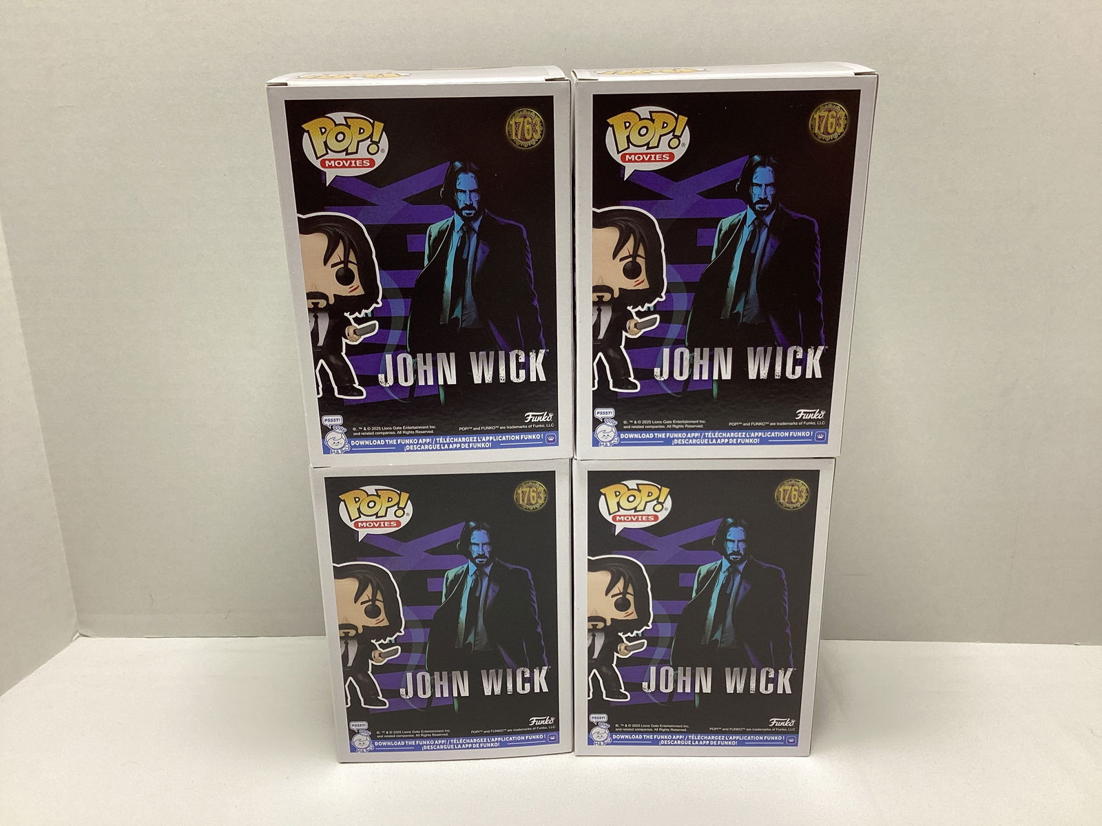 Four John Wick Funko Pops - 4