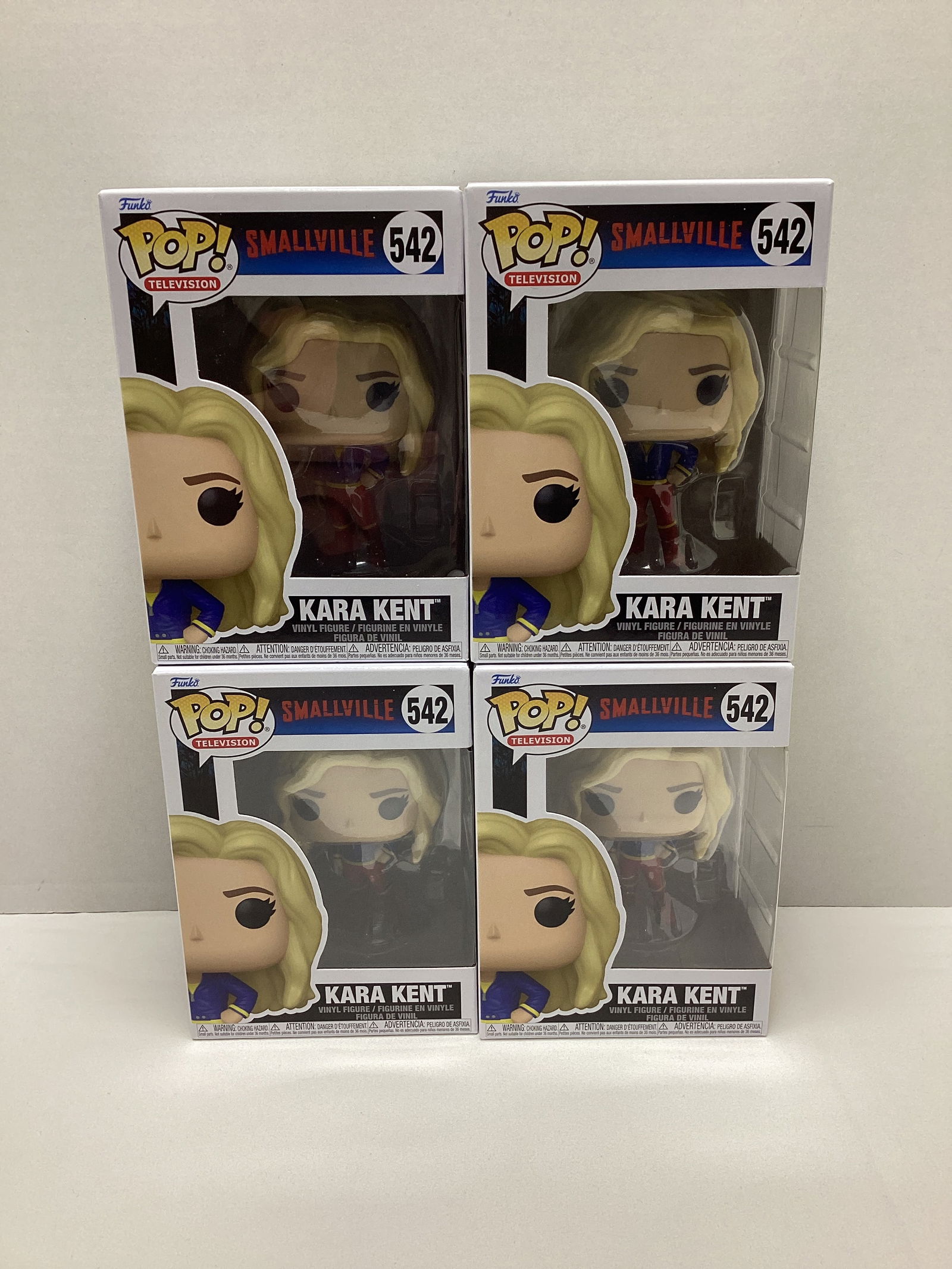 Four DC Smallville Kara Kent Funko Pops: . 