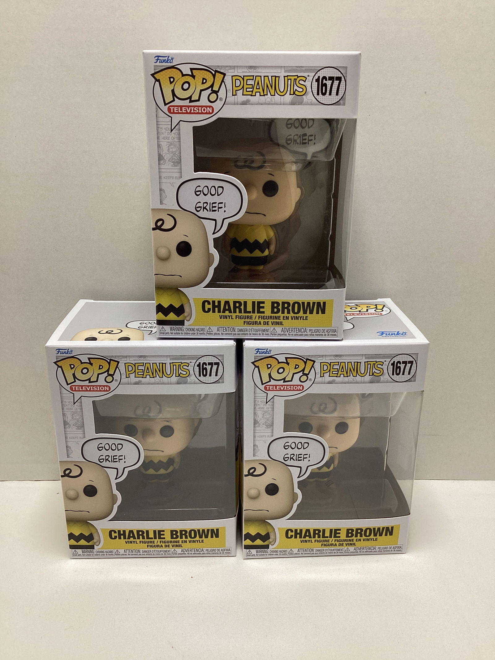 Three Peanuts Charlie Brown Funko Pops: . 