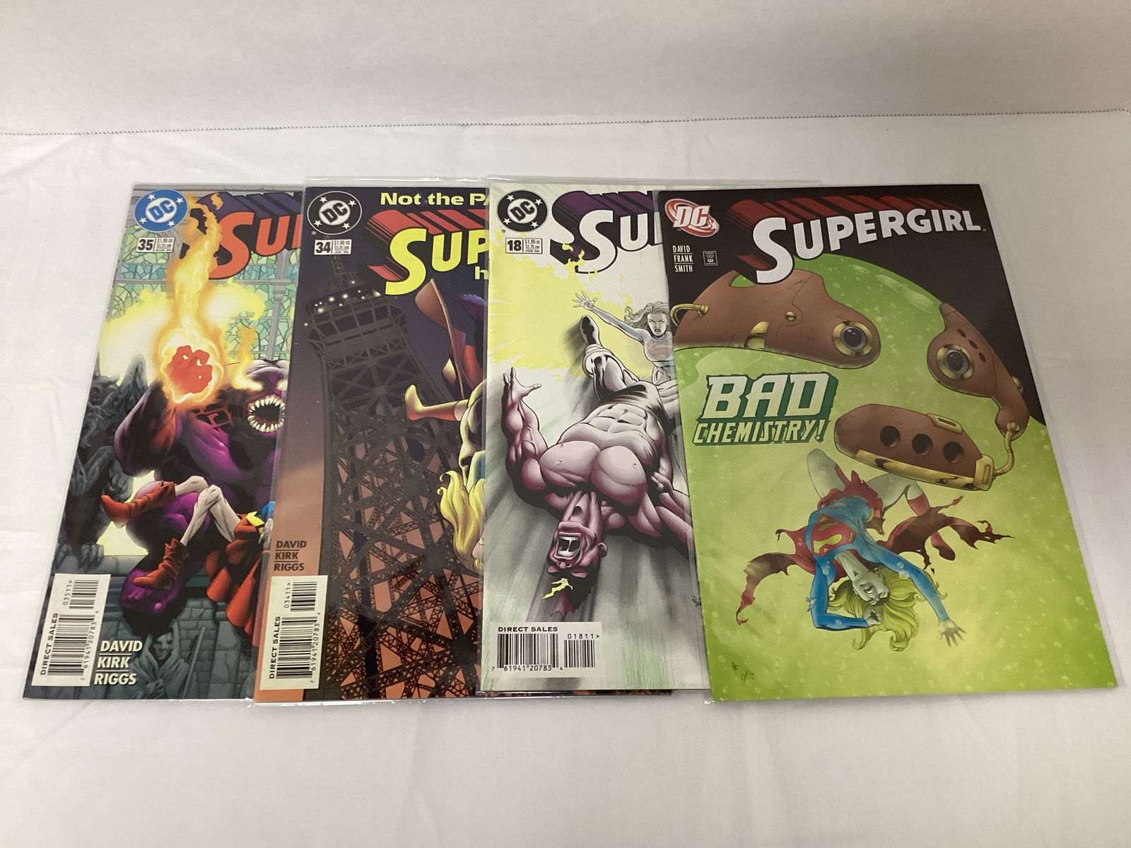 Four Supergirl DC Comic Books: please preview and see all photos for condition