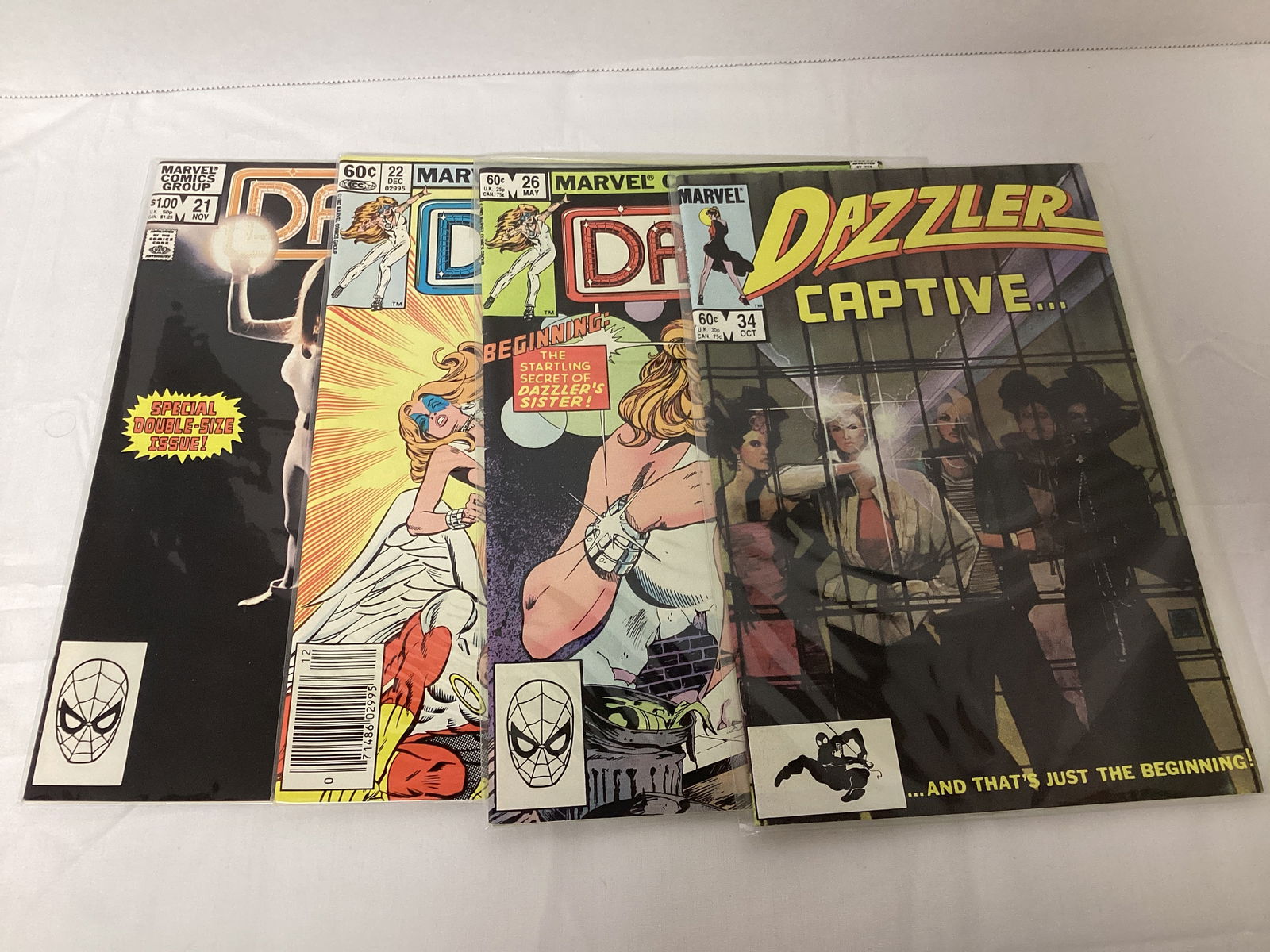 Four Dazzler Marvel Comic Books: please preview and see all photos for condition