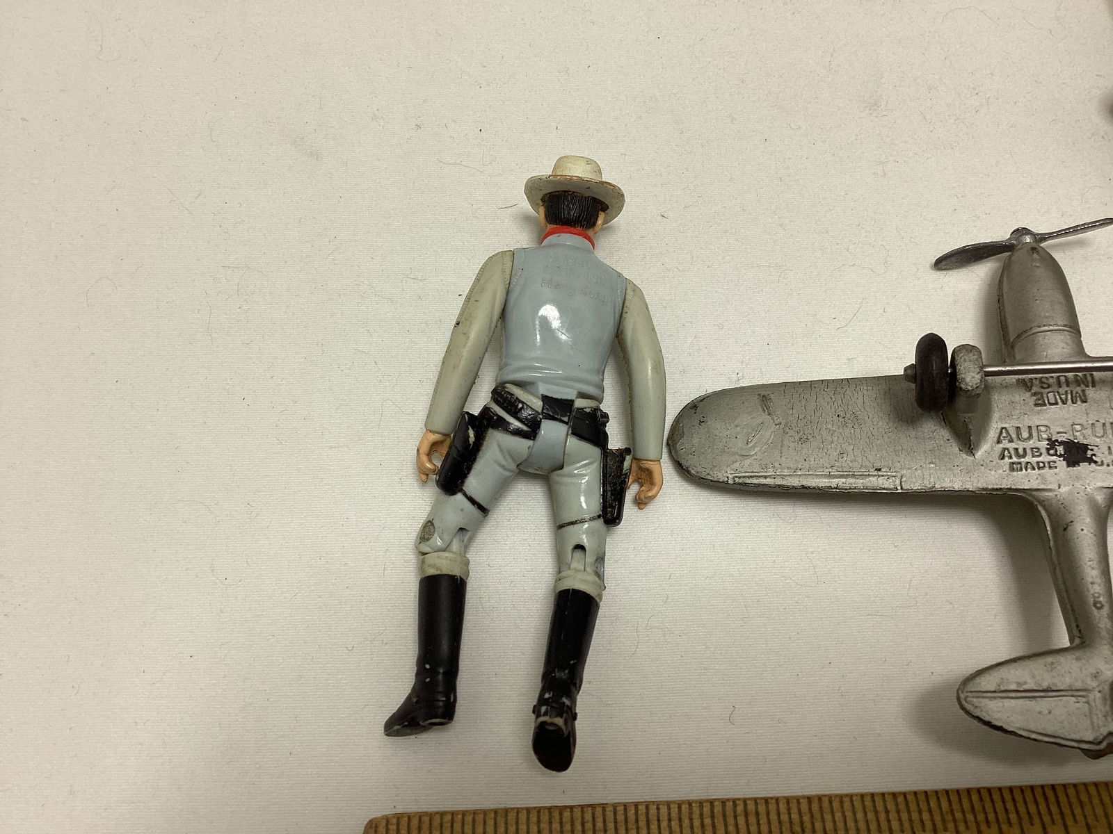 Auburn Rubber Racecar, Fossil Case, Lone Ranger Action Figure, and Auburn Airplane - 4