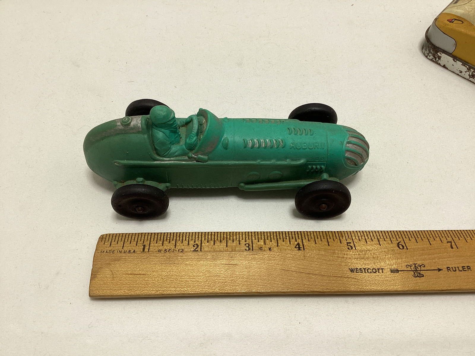 Auburn Rubber Racecar, Fossil Case, Lone Ranger Action Figure, and Auburn Airplane - 5