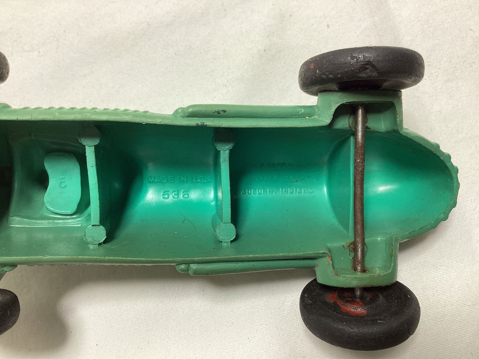Auburn Rubber Racecar, Fossil Case, Lone Ranger Action Figure, and Auburn Airplane - 6