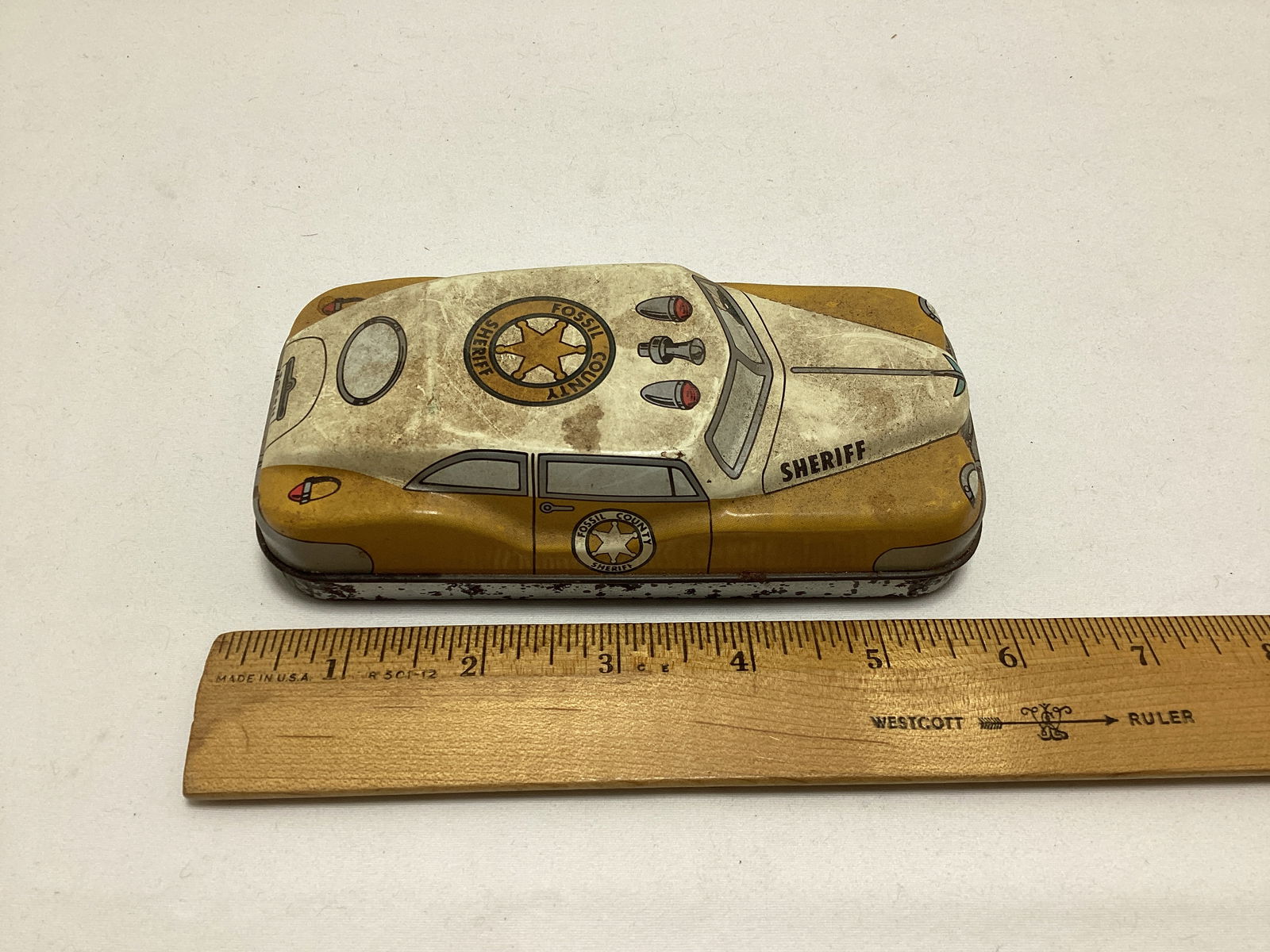 Auburn Rubber Racecar, Fossil Case, Lone Ranger Action Figure, and Auburn Airplane - 7