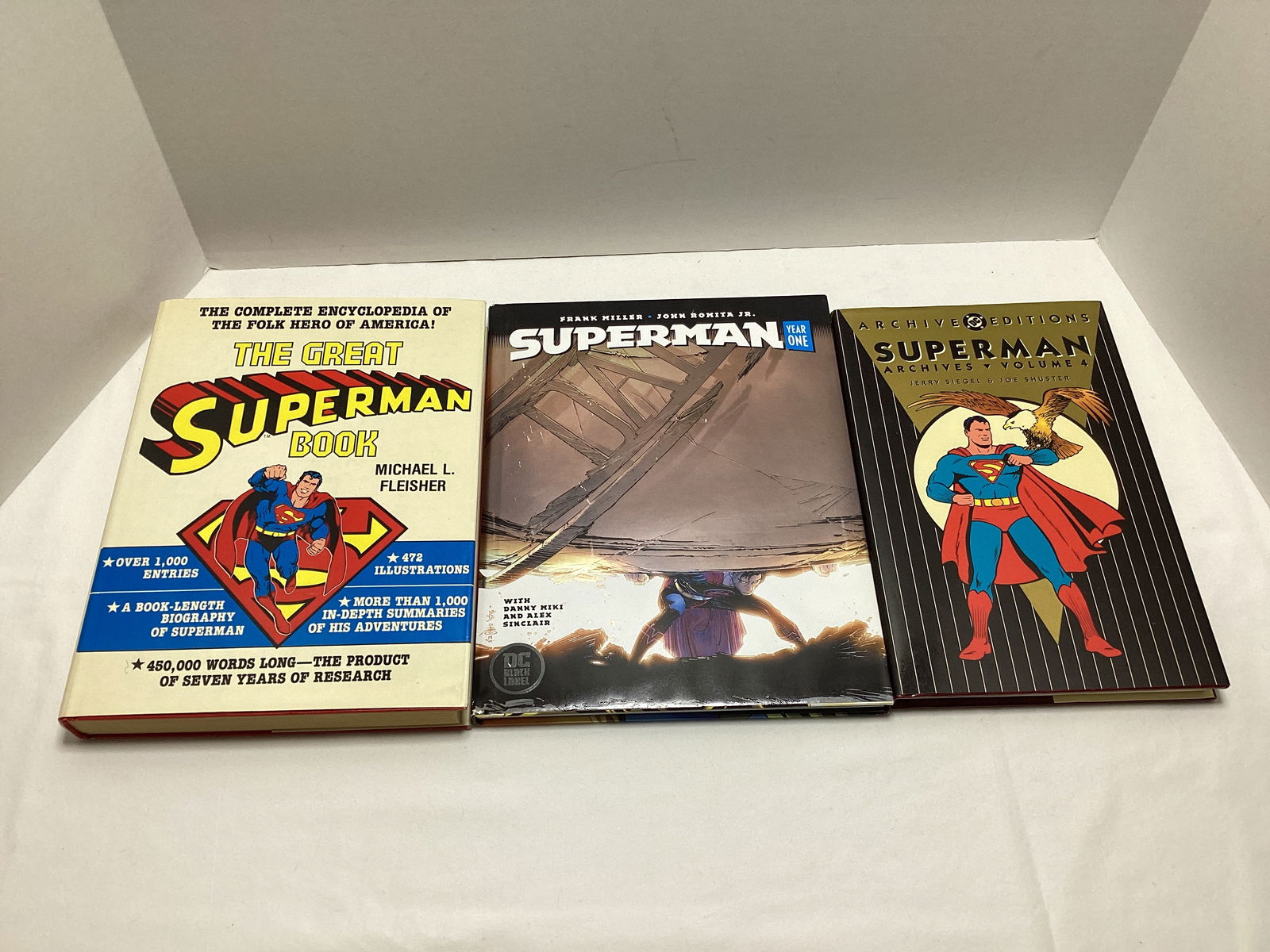 Three DC Superman Graphic Novel and History Books: . 