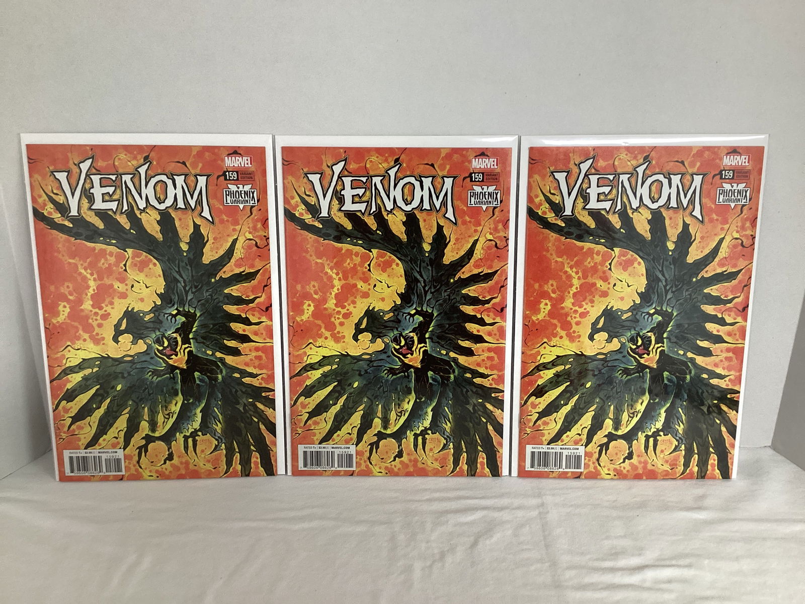 Three Venom 159 Phoenix Variant Marvel Comic Books: Please preview and see all photos for condition 