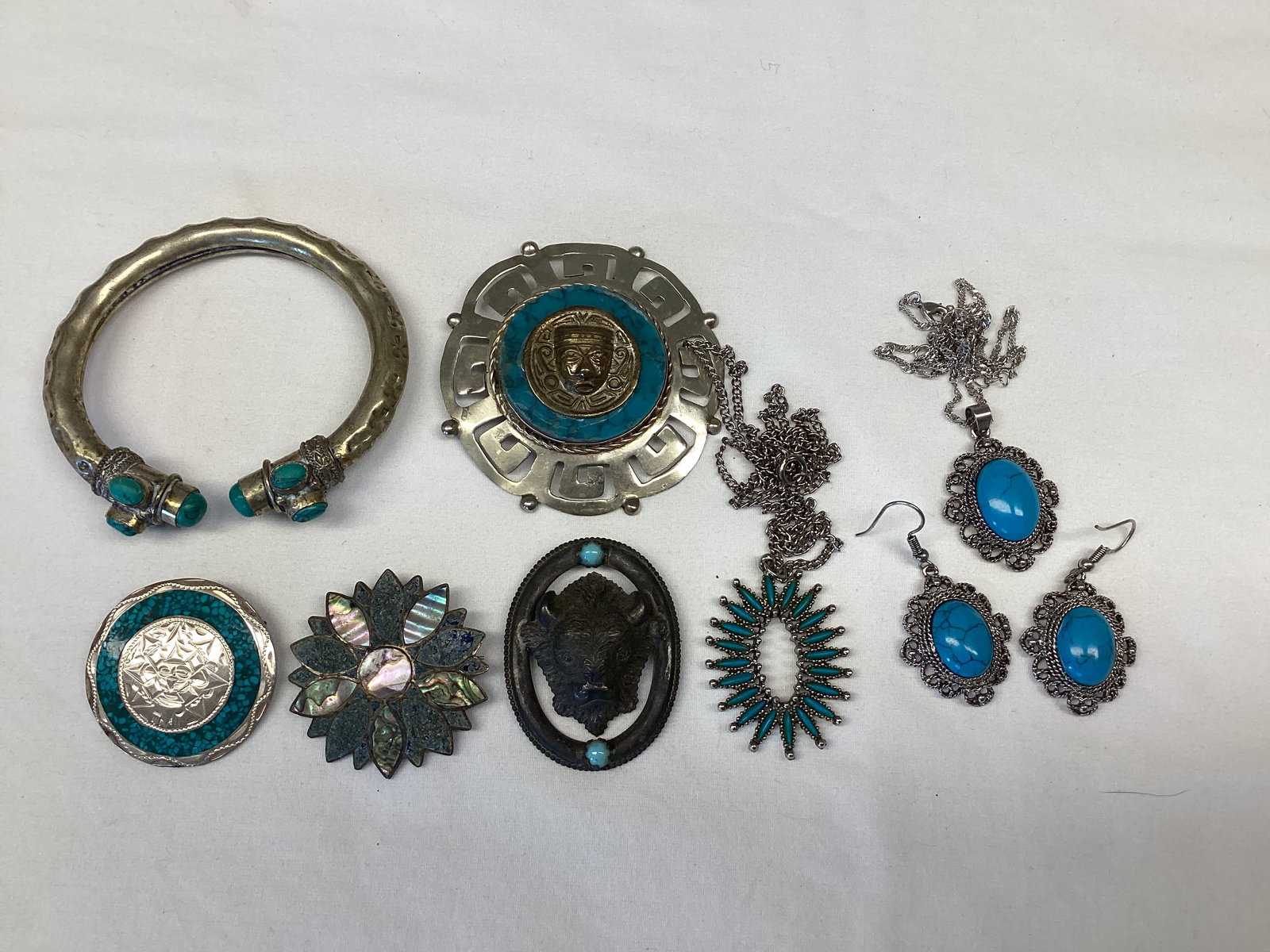 Silver and Turquoise Jewelry: one piece marked 925, center on largest pin is not lined up correctly 