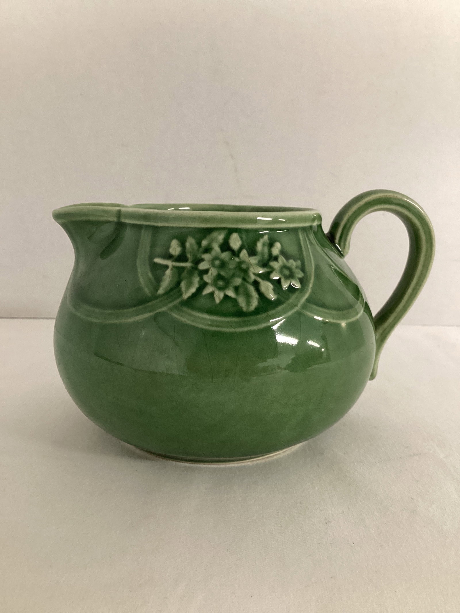 Green Floral Creamer Made in Portugal: 3 1/2" h, crazing