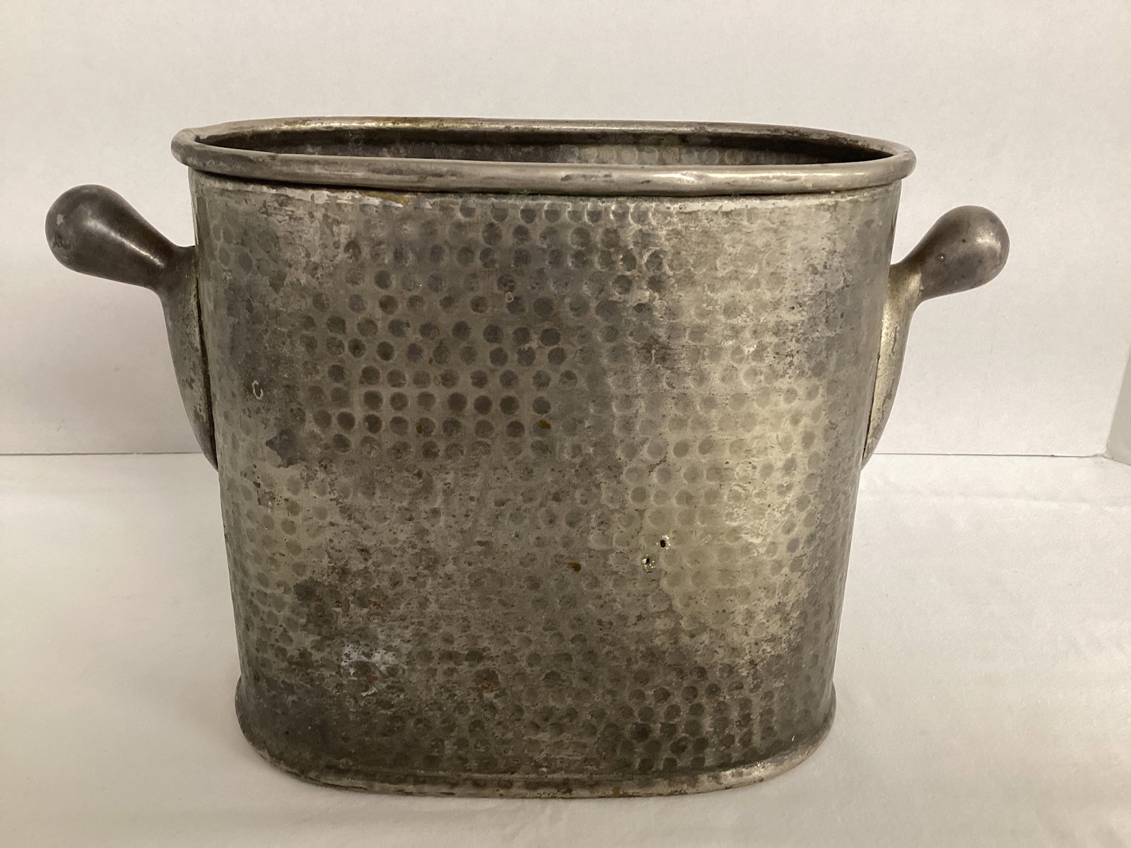 Hammered Oval Vessel with Handles: Made in India, 10 1/2" at handles, 7" h 