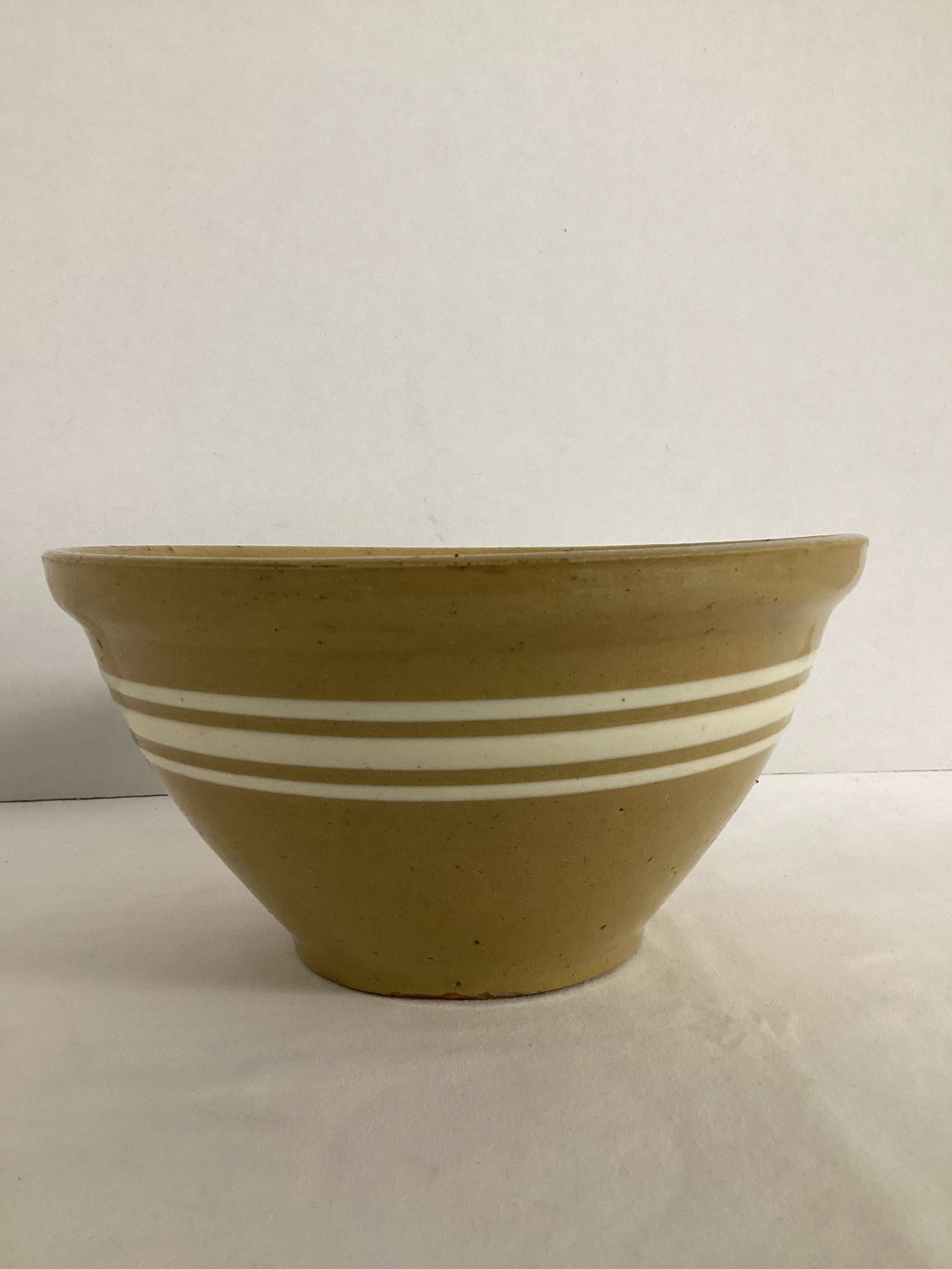 Antique Yellow Ware Bowl with Cream Stripes: cracked, chip on edge, 7 3/4" diameter x 4" h 