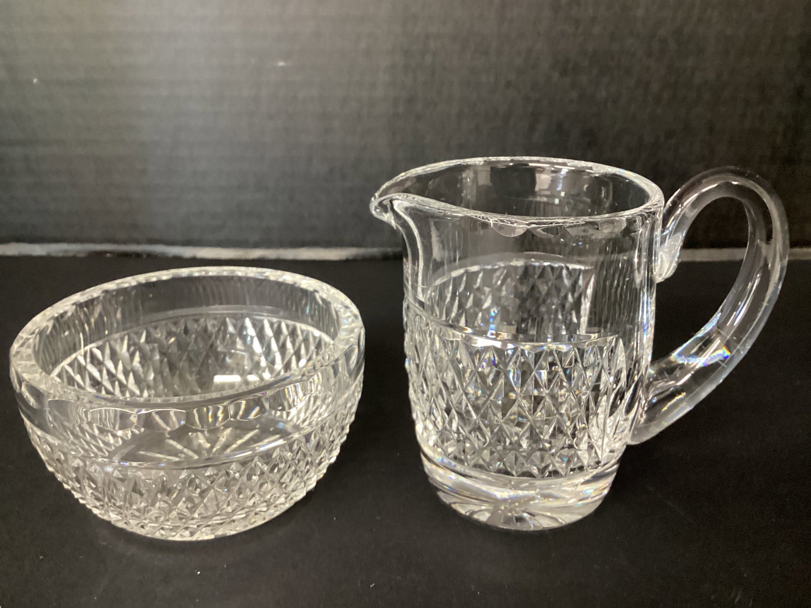 Waterford Crystal Creamer and Open Sugar Bowl: creamer has a crack at the top of the handle, 4" h creamer, 3 7/8" diameter x 2 1/8" h sugar 