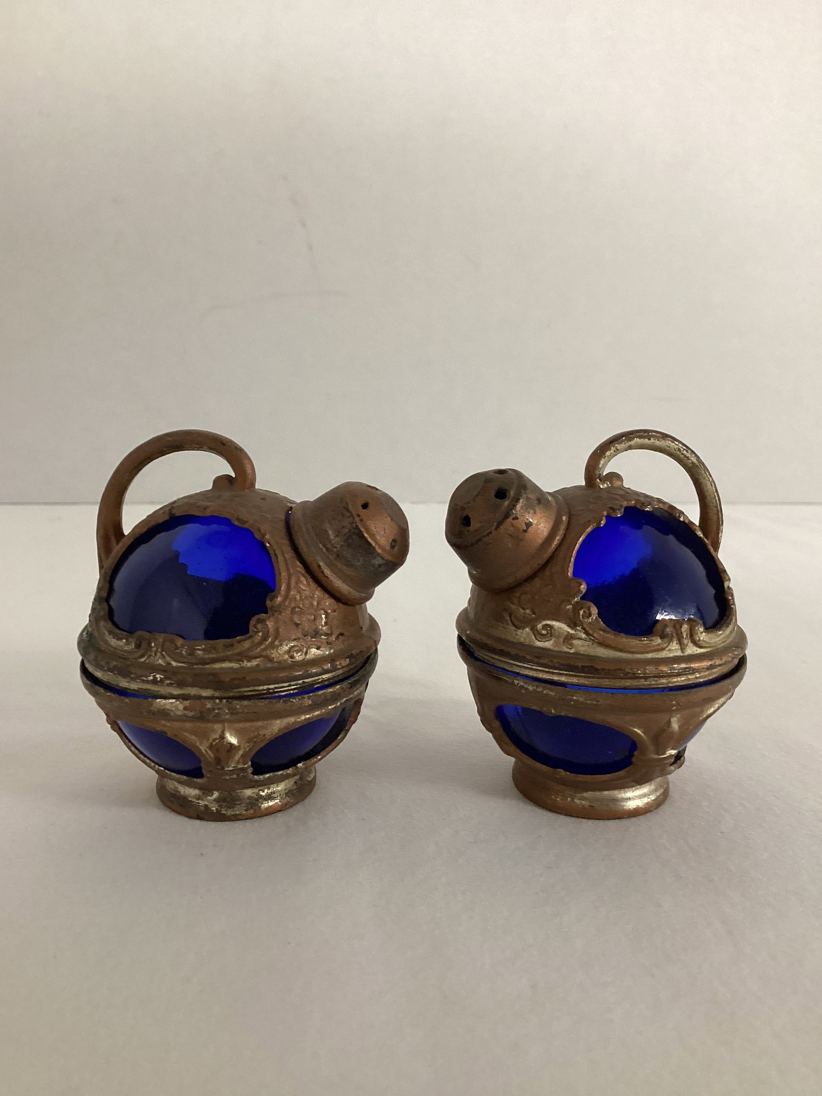 Pair of Vintage Cobalt Blue Glass and Metal Salt and Pepper Shakers: Made in Japan, 2 1/4" h, some finish wear and bends to metal