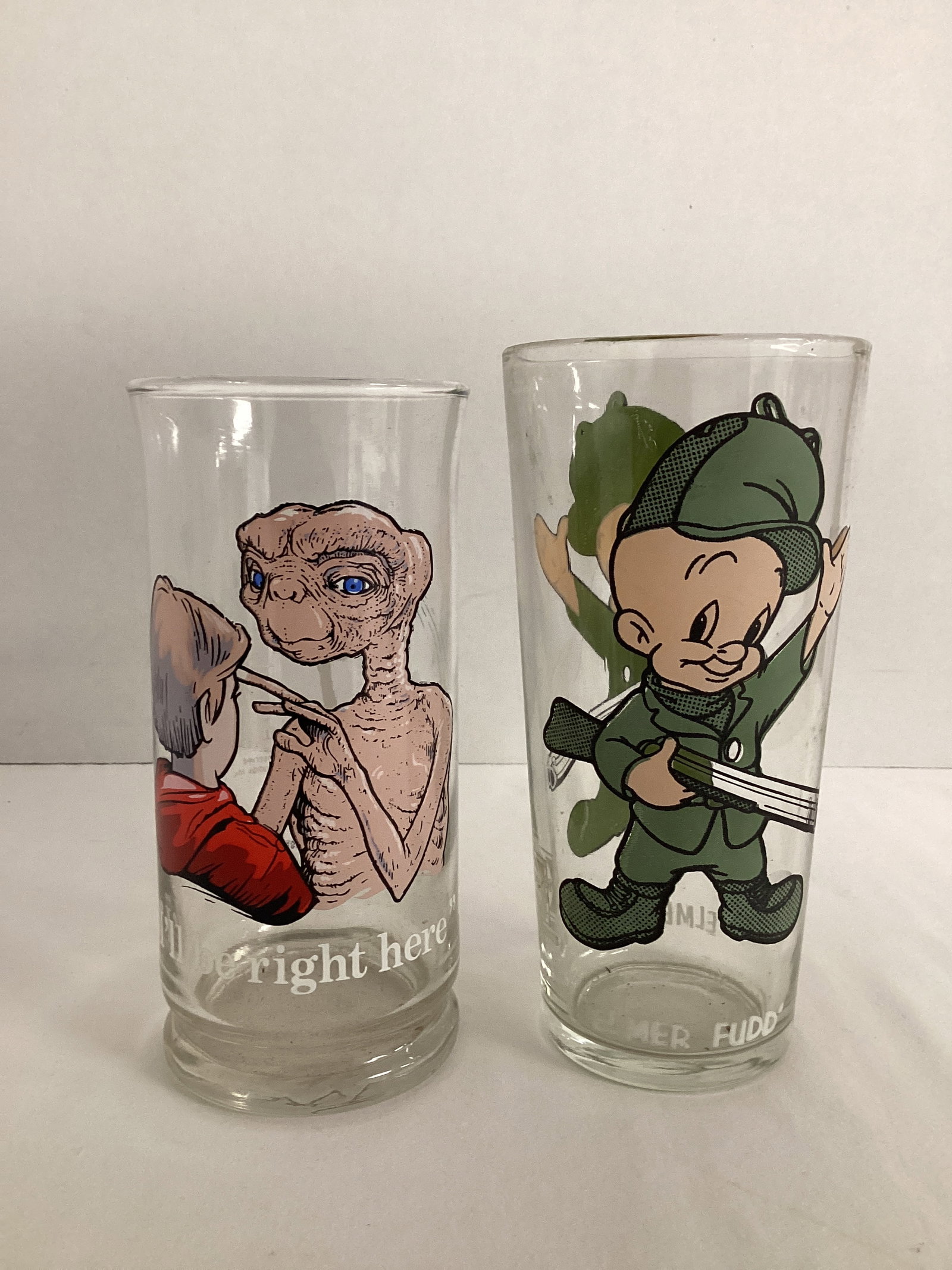 1982 Pizza Hut E.T. Glass and 1973 Pepsi Warner Brothers Elmer Fudd Glass: 6" and 6 1/4" h 