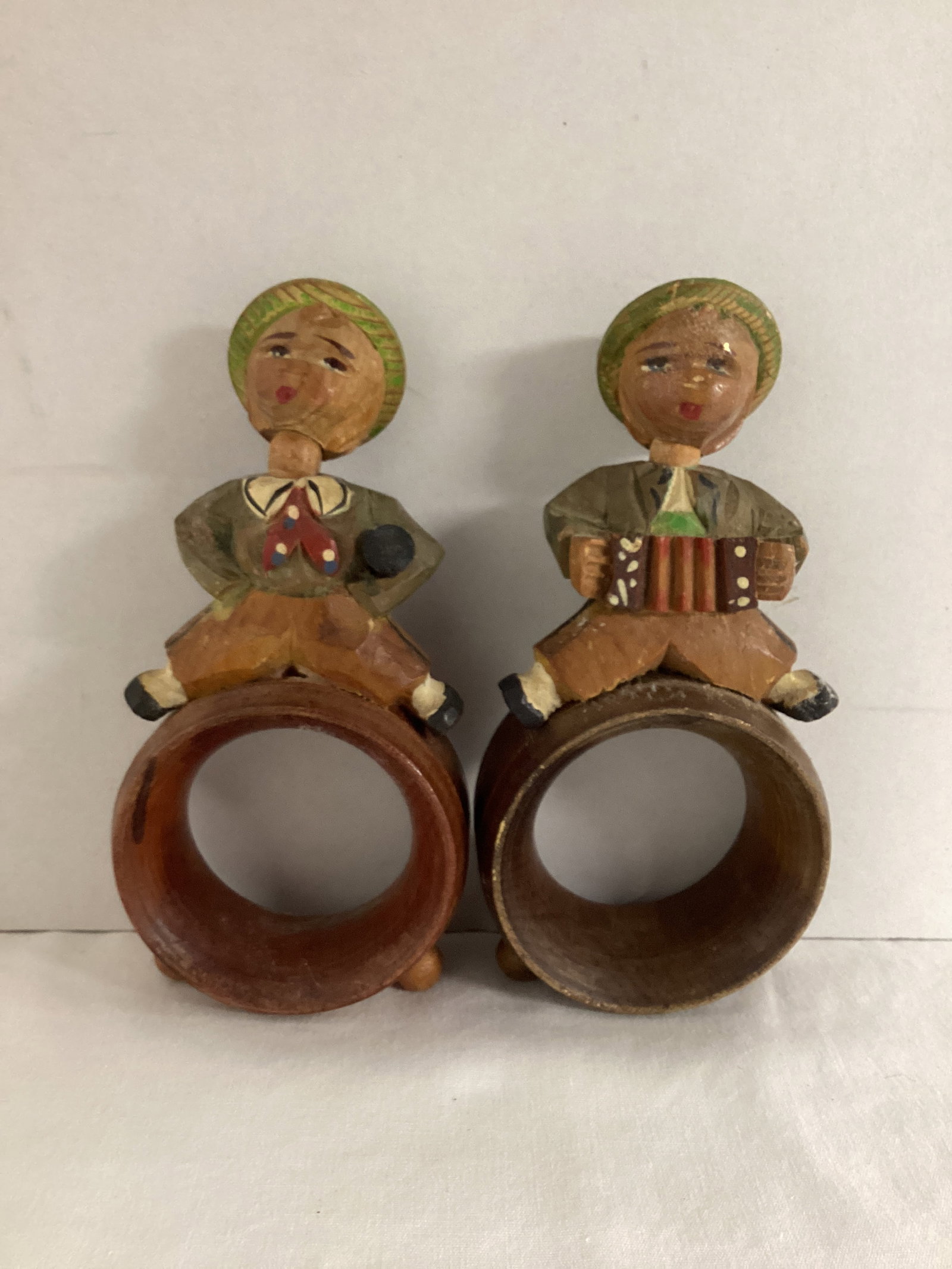 Pair of Wood Carved Napkin Rings Featuring Boys with Musical Instruments (1 of 6)