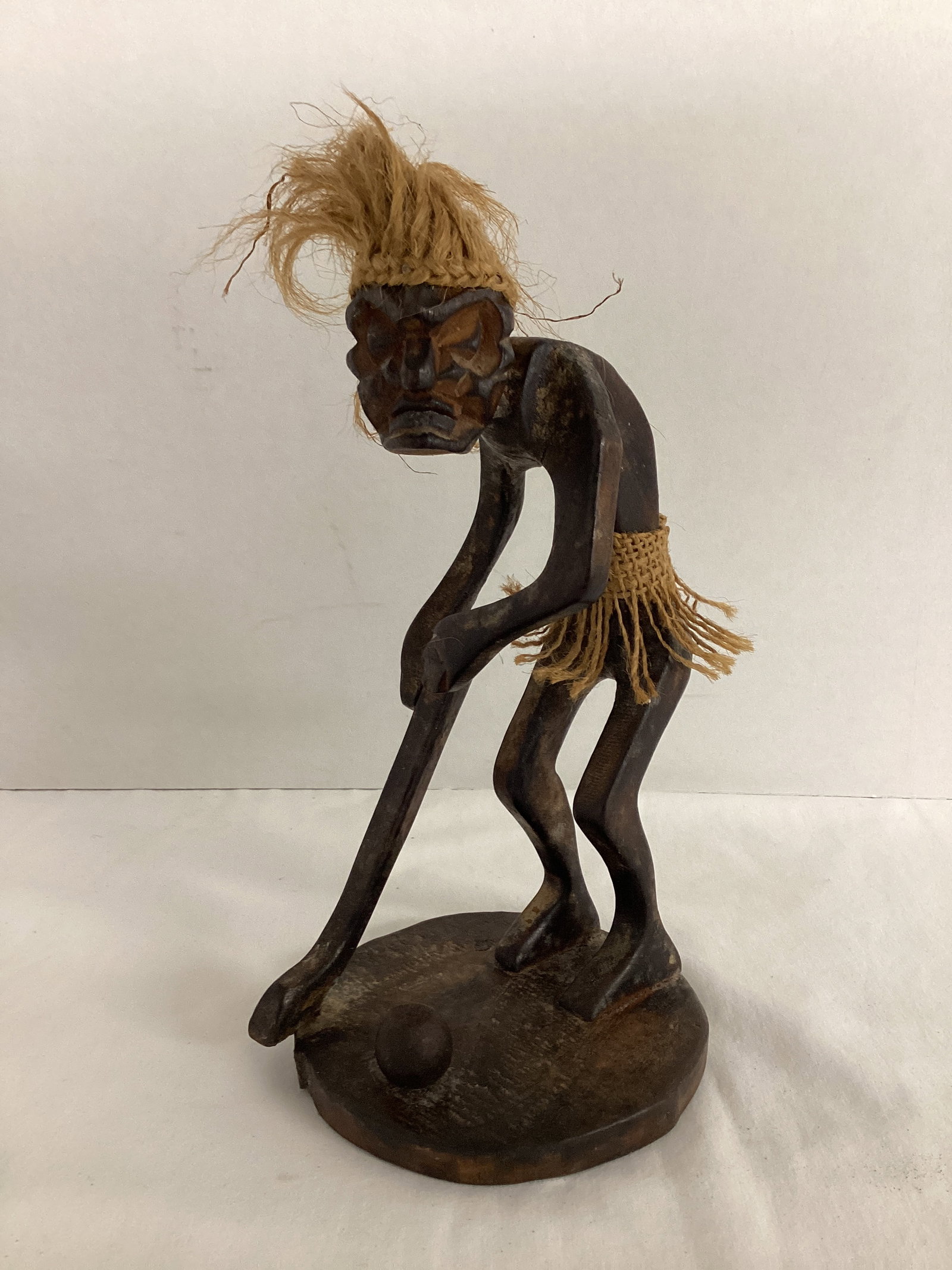 Tribal Man Playing Golf Wood Figure: 9" h