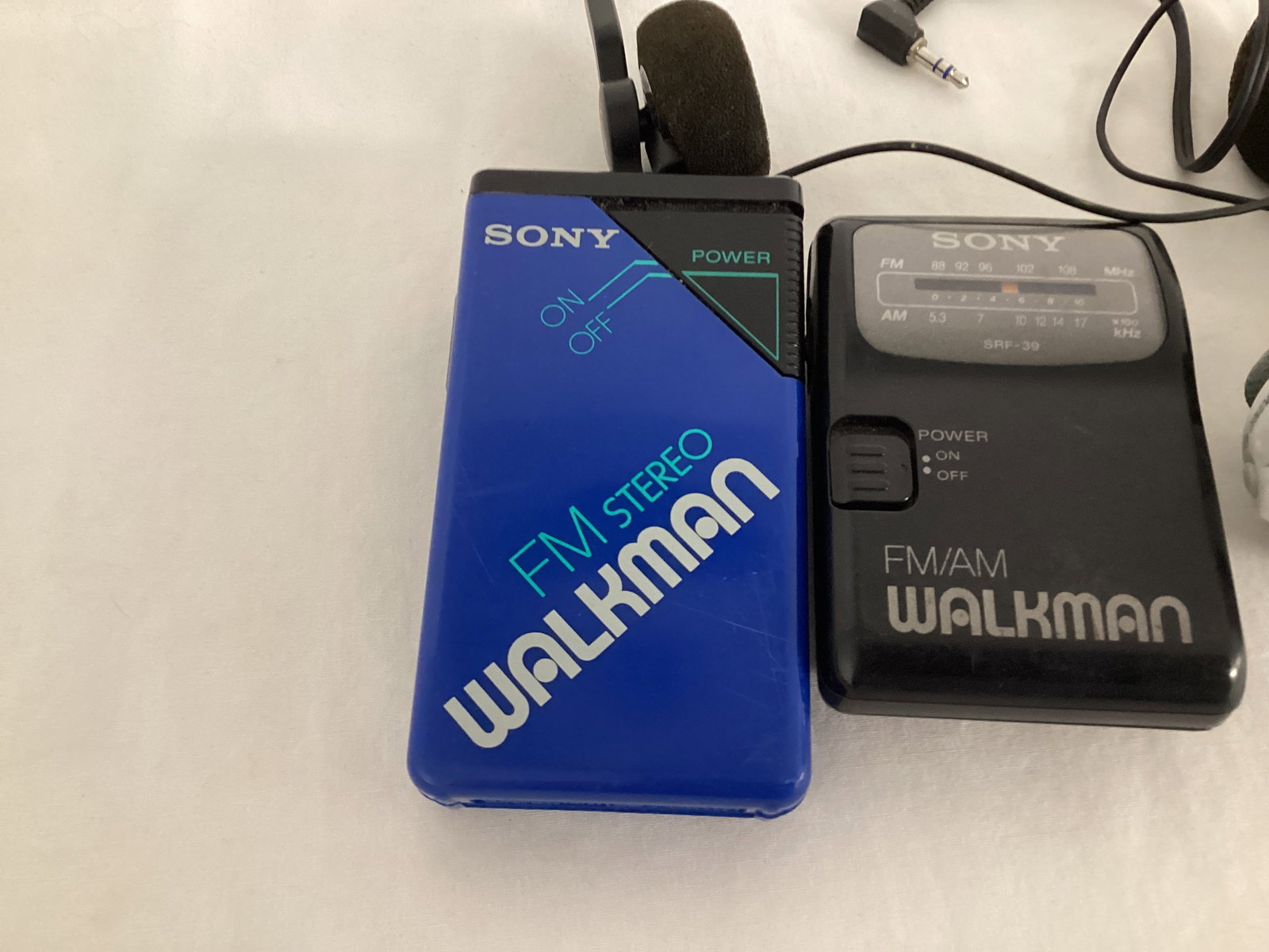 Three Sony Walkman and One Headset - 2