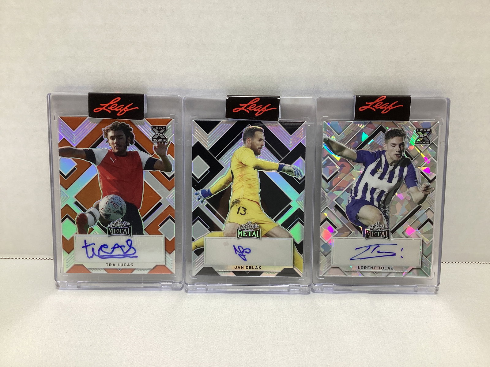 Three Leaf Metal Autographed Soccer Cards: .