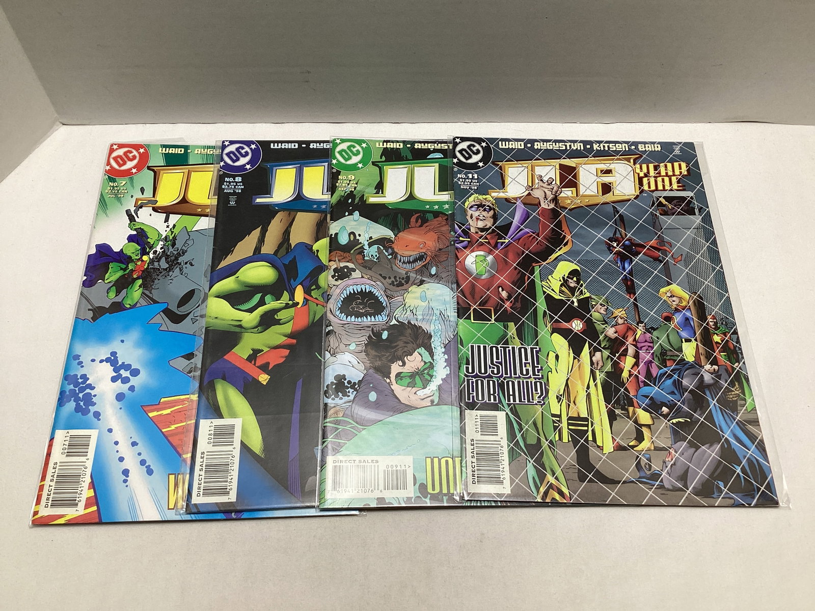 Four JLA Year One DC Comic Books: please preview and see all photos for condition