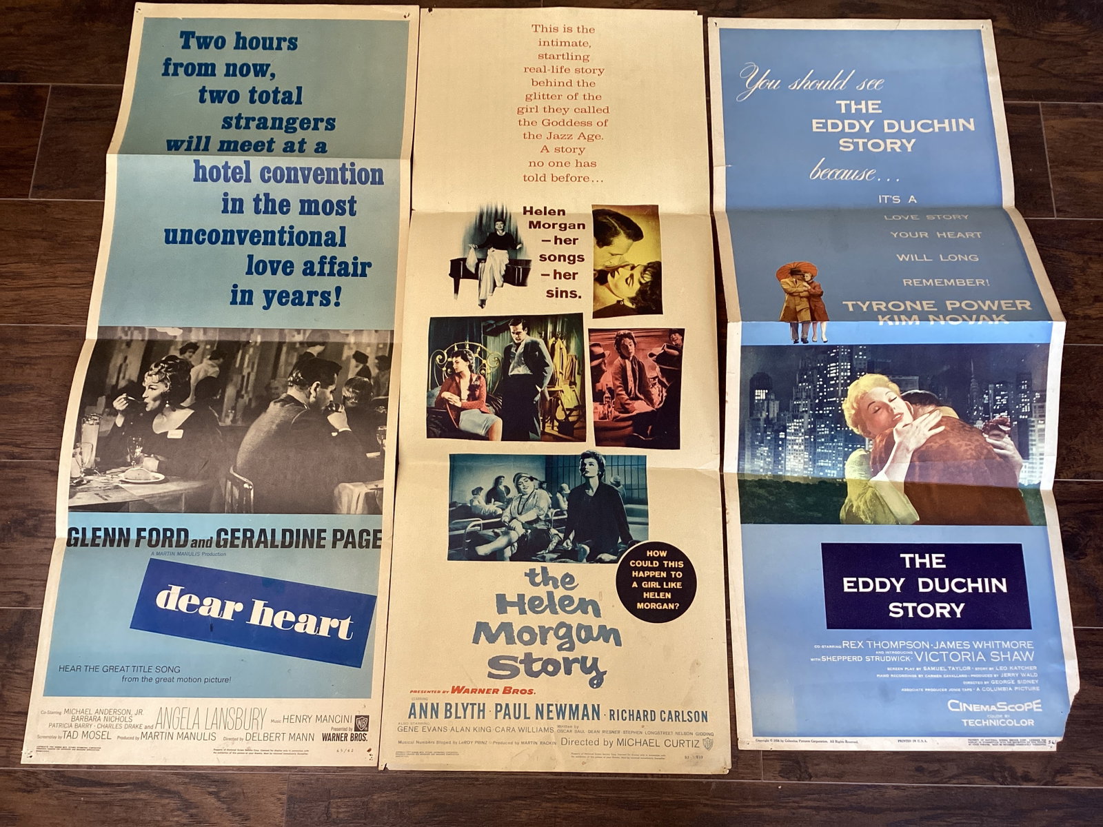 Three Folded Movie Posters: Dear Heart dated 1965, 14" w x 36" h. The Helen Morgan Story dated 1957, 14" w x 36" h. The Eddy Duncan Story dated 1956, 14" w x 35" h. Please preview for condition.