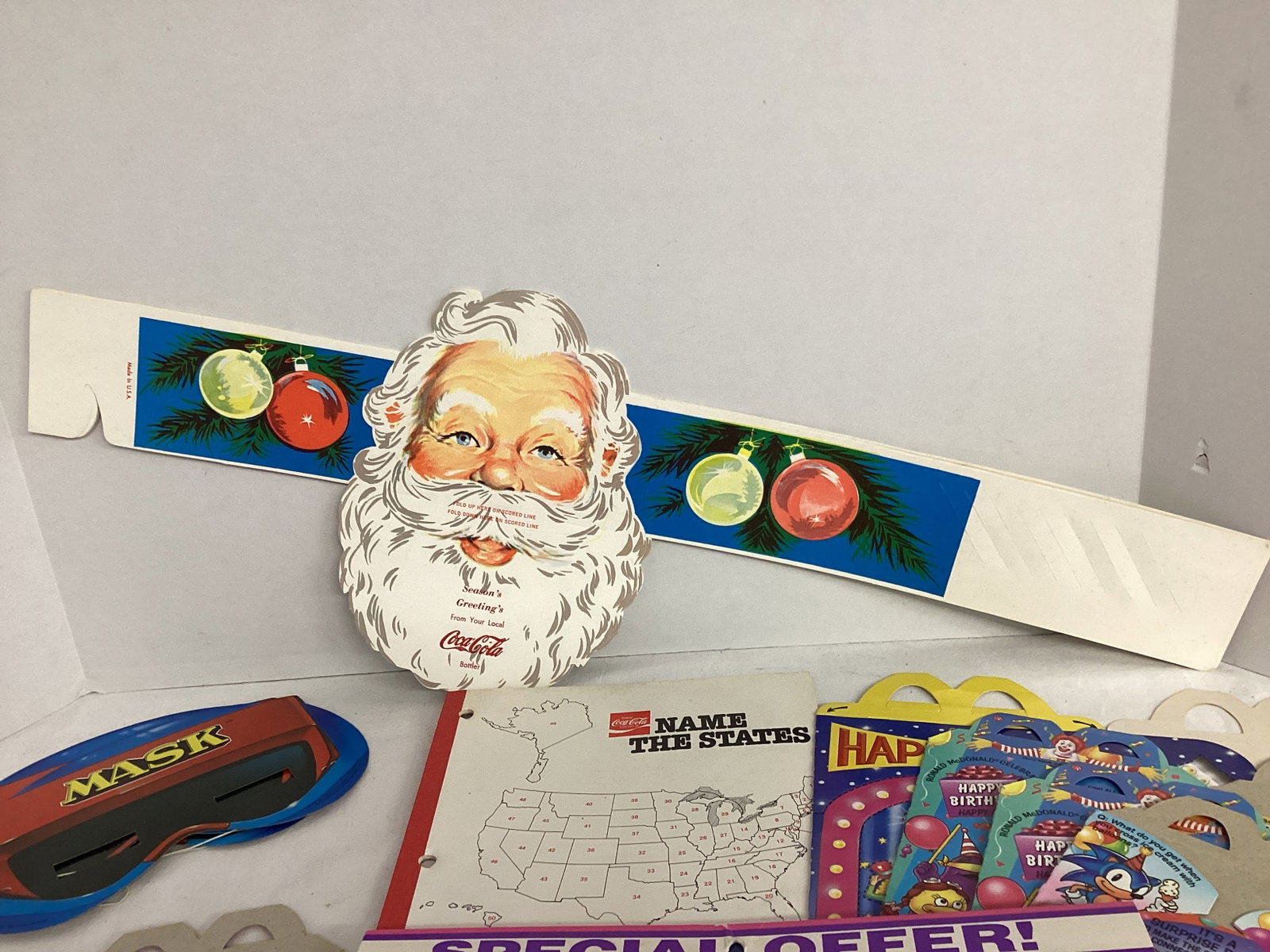 Coca-Cola Santa Headband and 50 States Notebook, McDonalds Happy Meal Boxes, Barbie Calendar - 2
