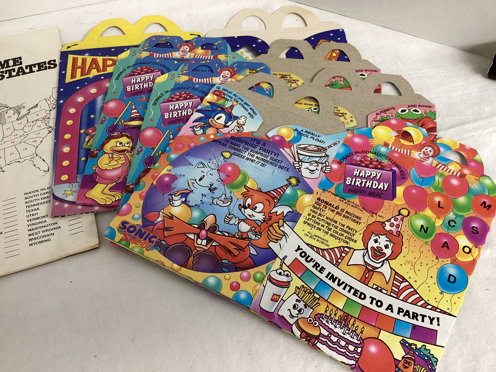 Coca-Cola Santa Headband and 50 States Notebook, McDonalds Happy Meal Boxes, Barbie Calendar - 6