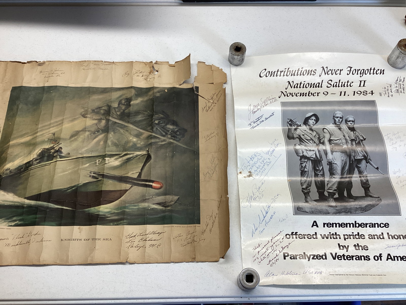 Two Signed Military Posters: 1943 Knights of the Sea 23 1/2" x 19 1/2" h, 1984 Veterans Day 17 1/2" x 22 1/2" h, see all photos for condition