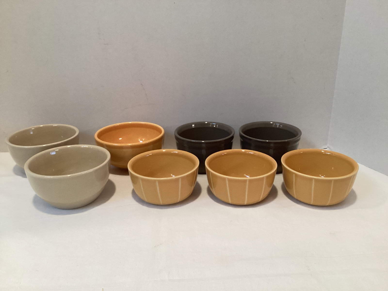 Eight Stoneware Fruit Dessert Bowls: Pottery Barn, Emile Henry, approx. 3 1/2" diameter